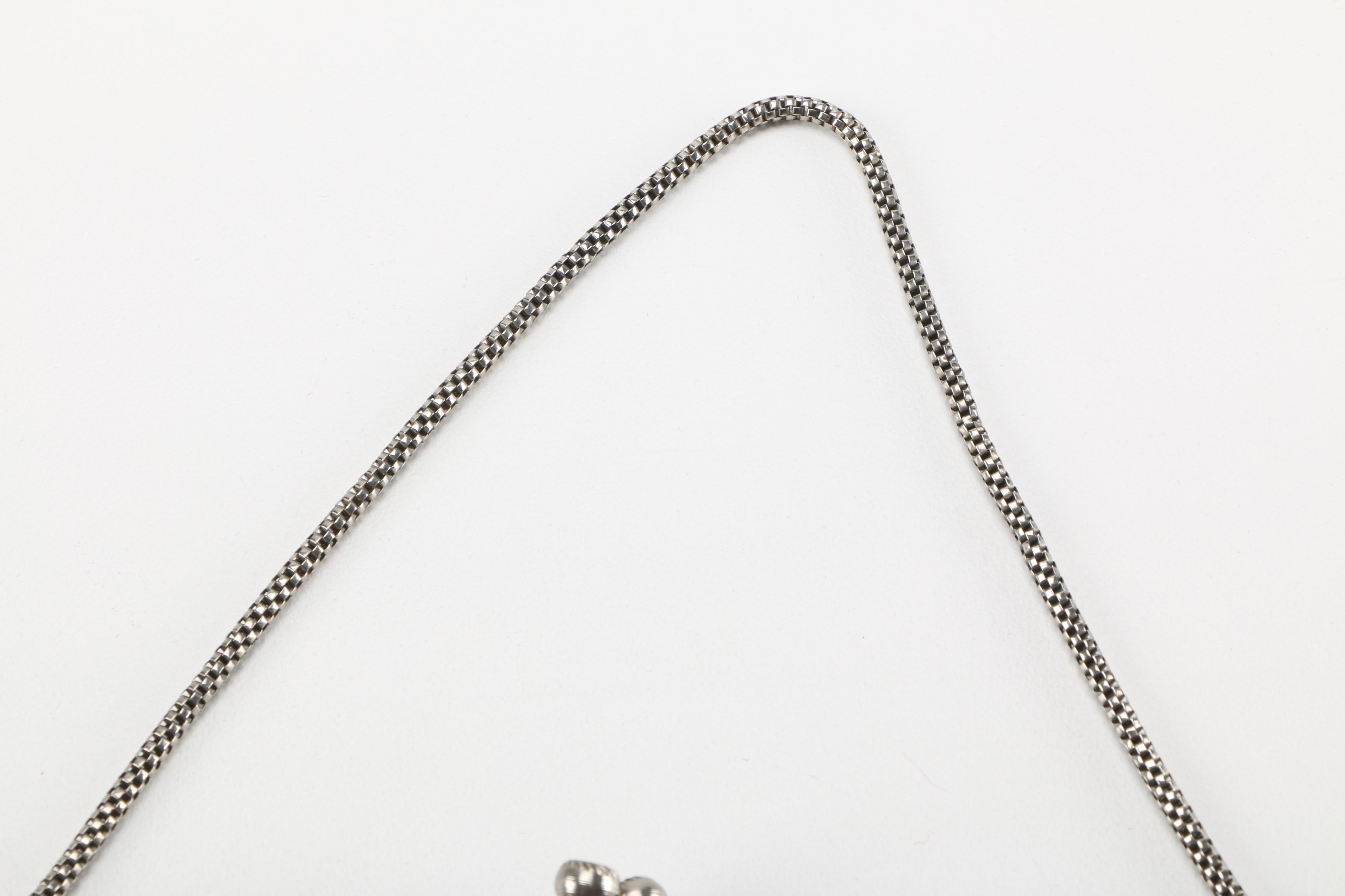 Three Vintage and Contemporary Purses With Floral Designs