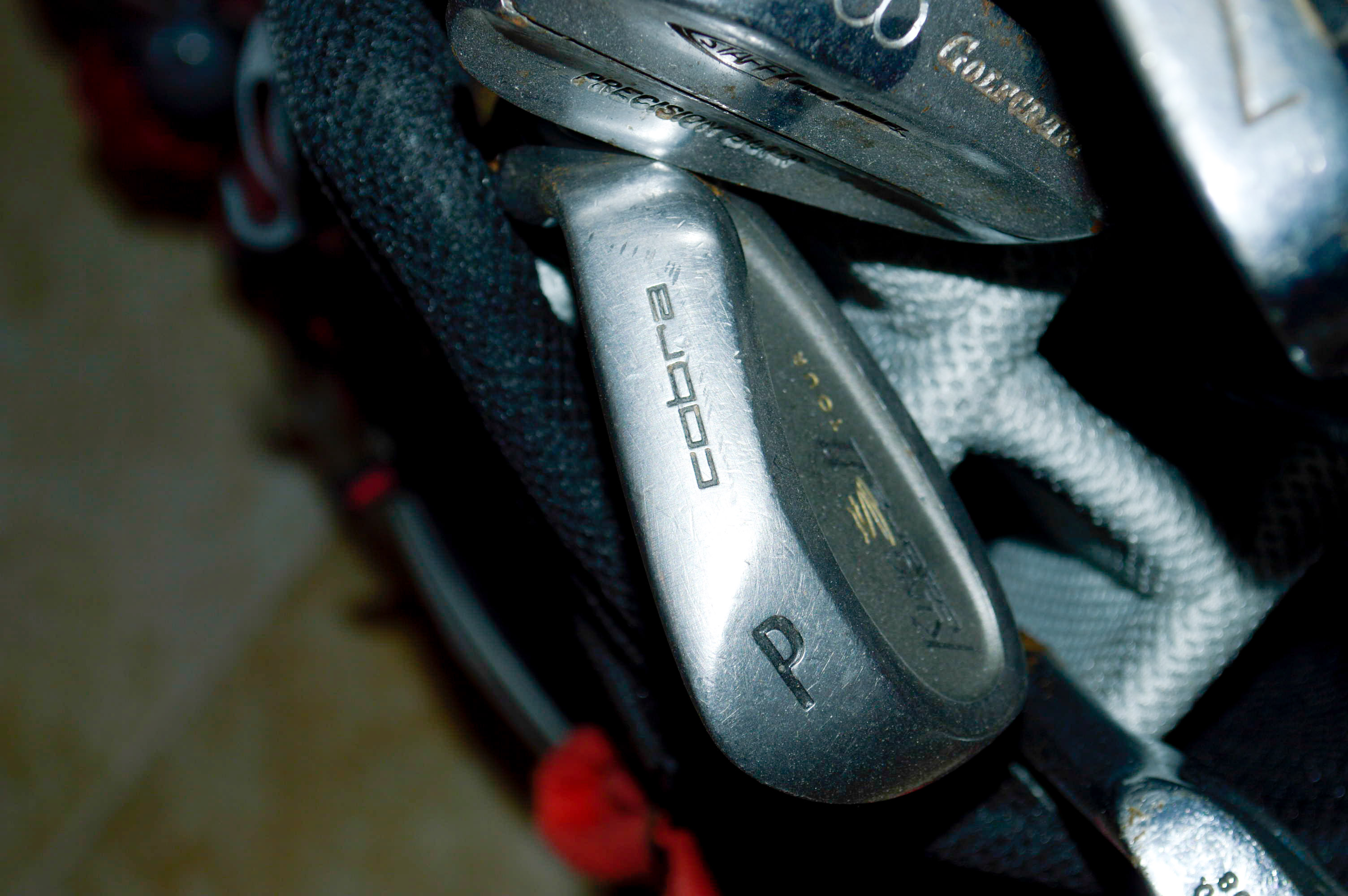 Assorted Golf Clubs with Coors Light Golf Bag