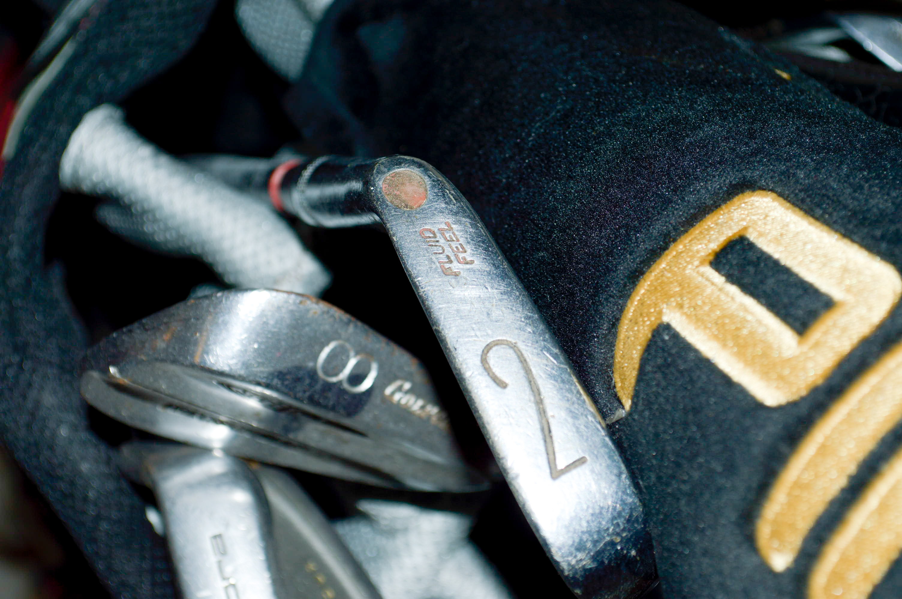 Assorted Golf Clubs with Coors Light Golf Bag