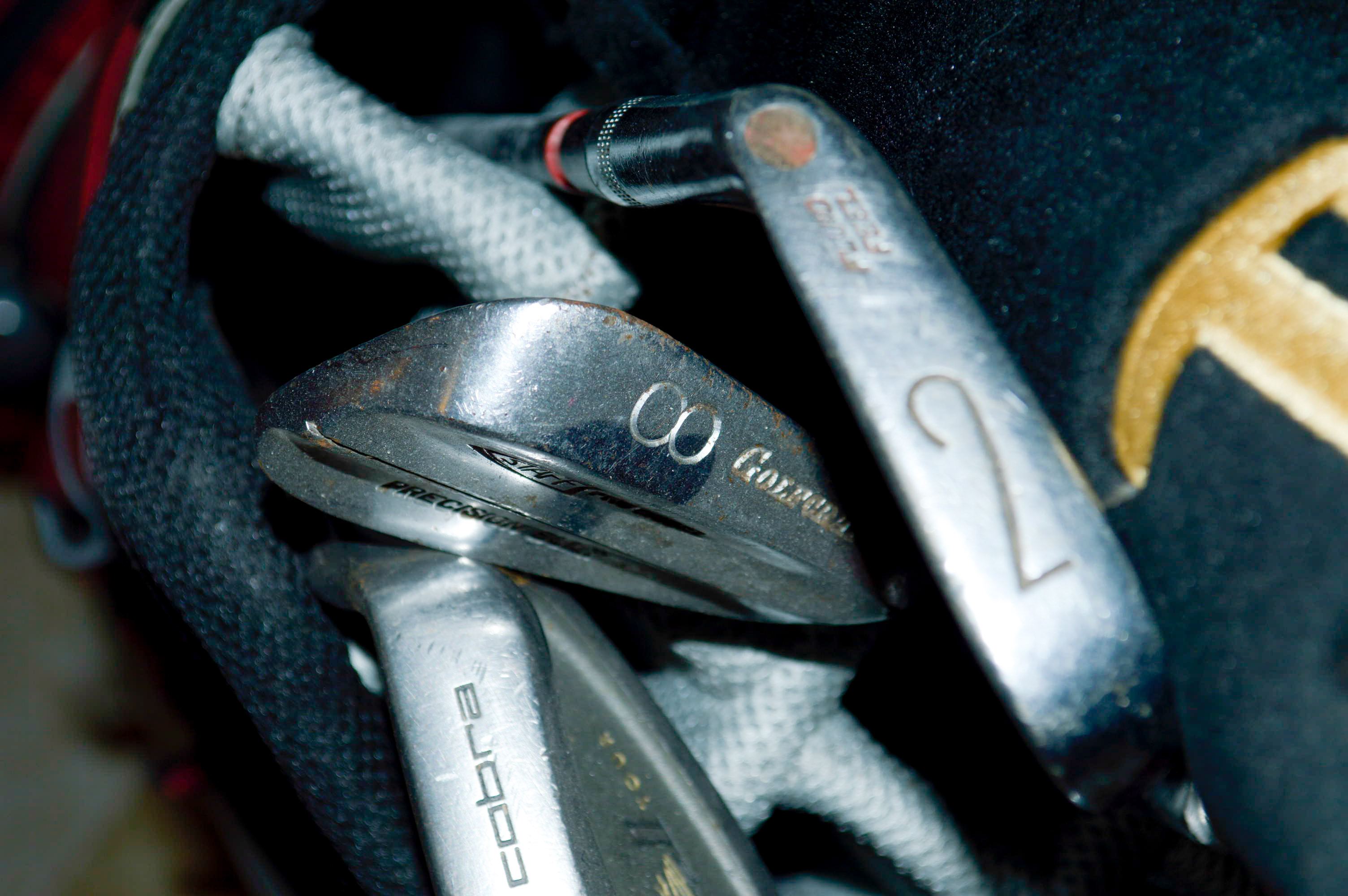 Assorted Golf Clubs with Coors Light Golf Bag