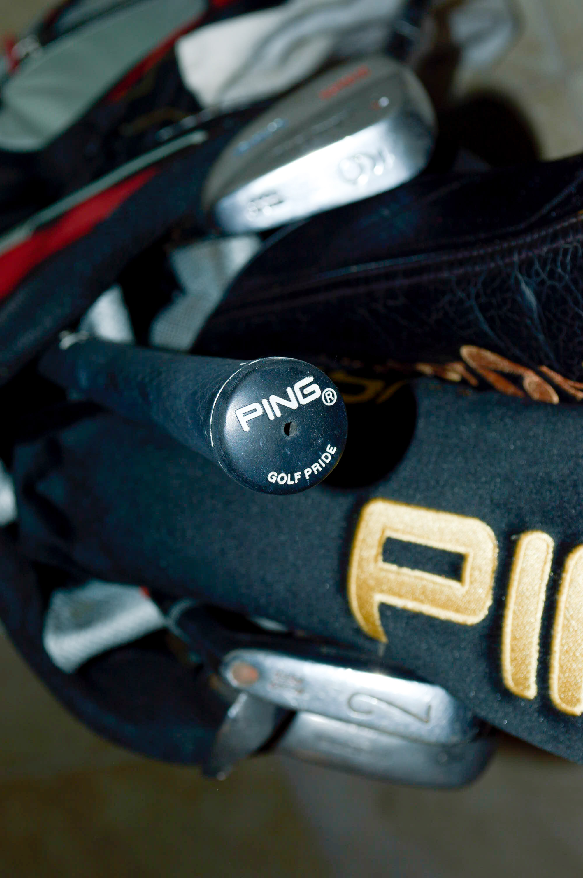 Assorted Golf Clubs with Coors Light Golf Bag