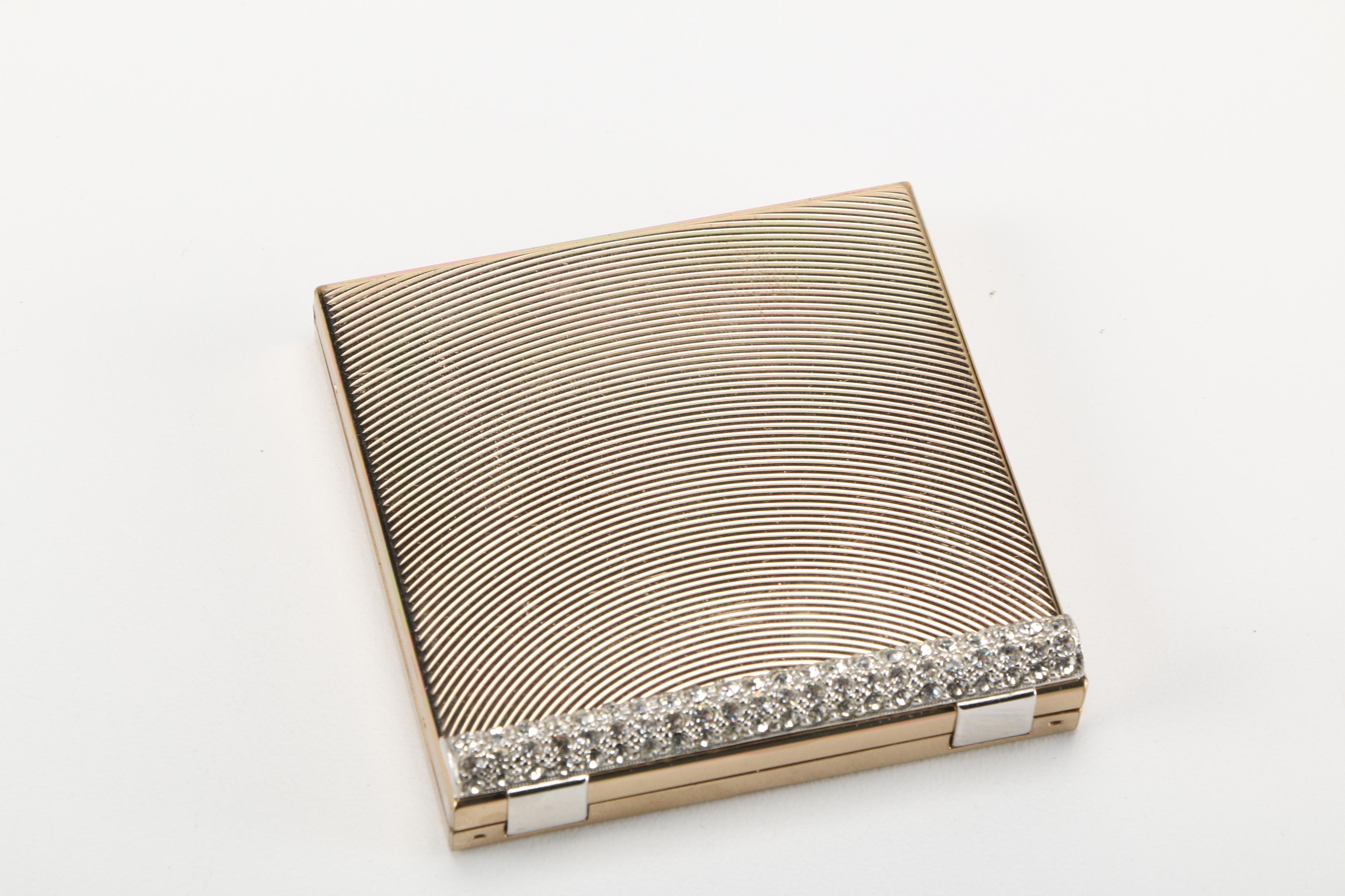 Three Gold Tone and Silver Tone Compacts