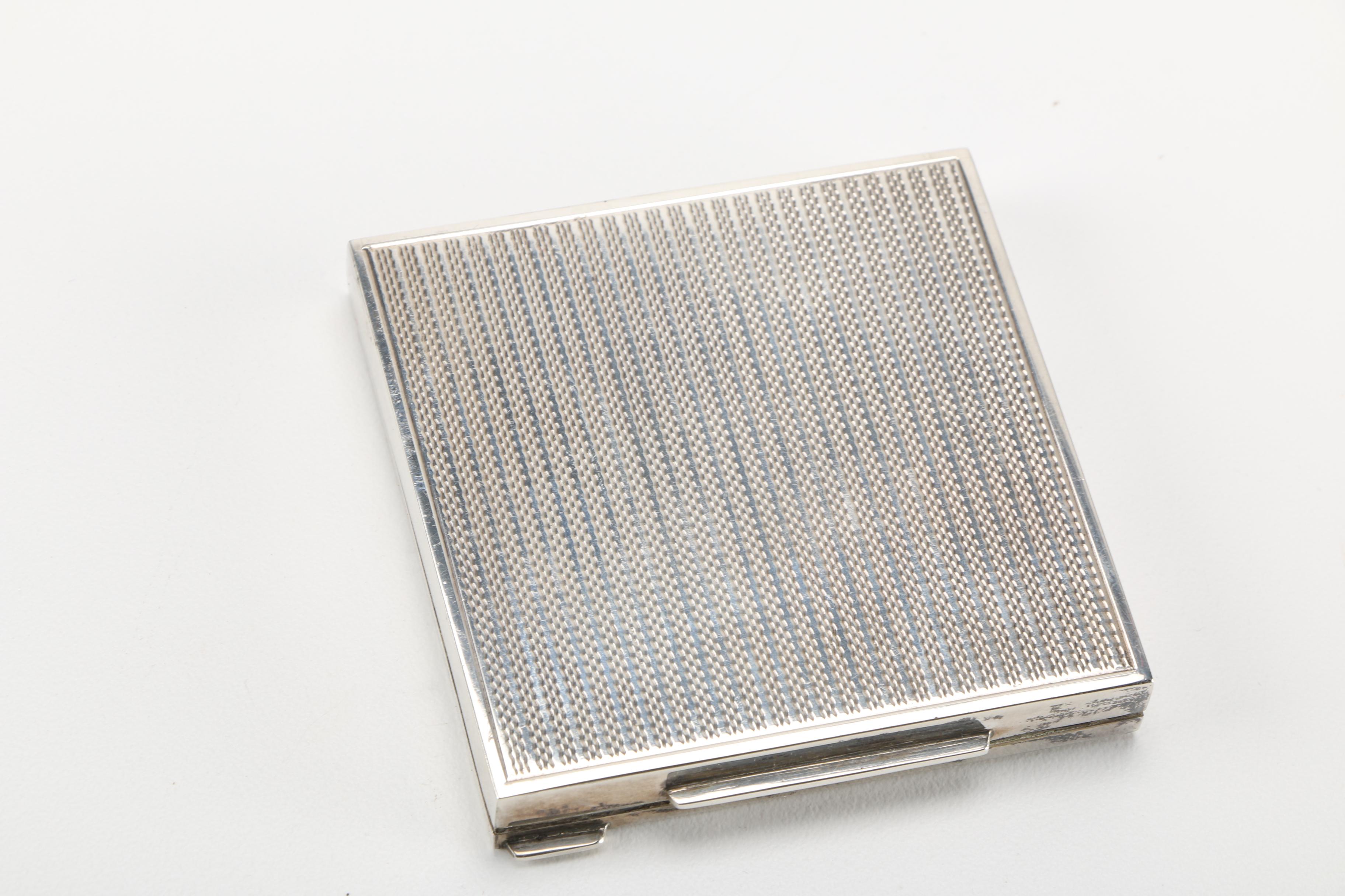 Three Gold Tone and Silver Tone Compacts