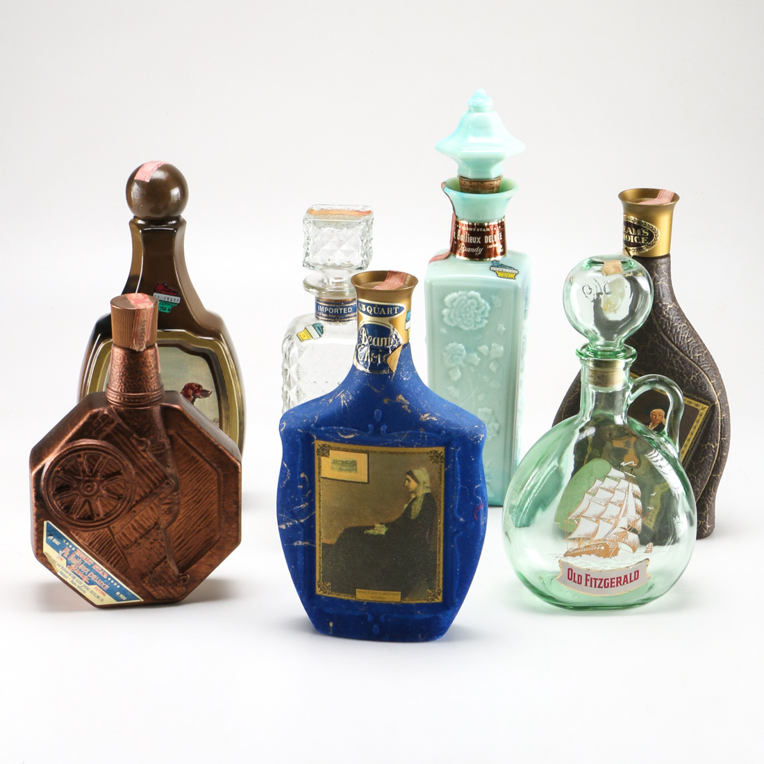Seven Vintage Branded Decanters and Bottles