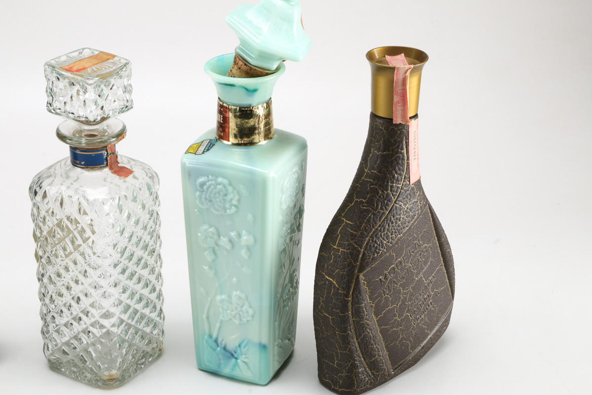 Seven Vintage Branded Decanters and Bottles