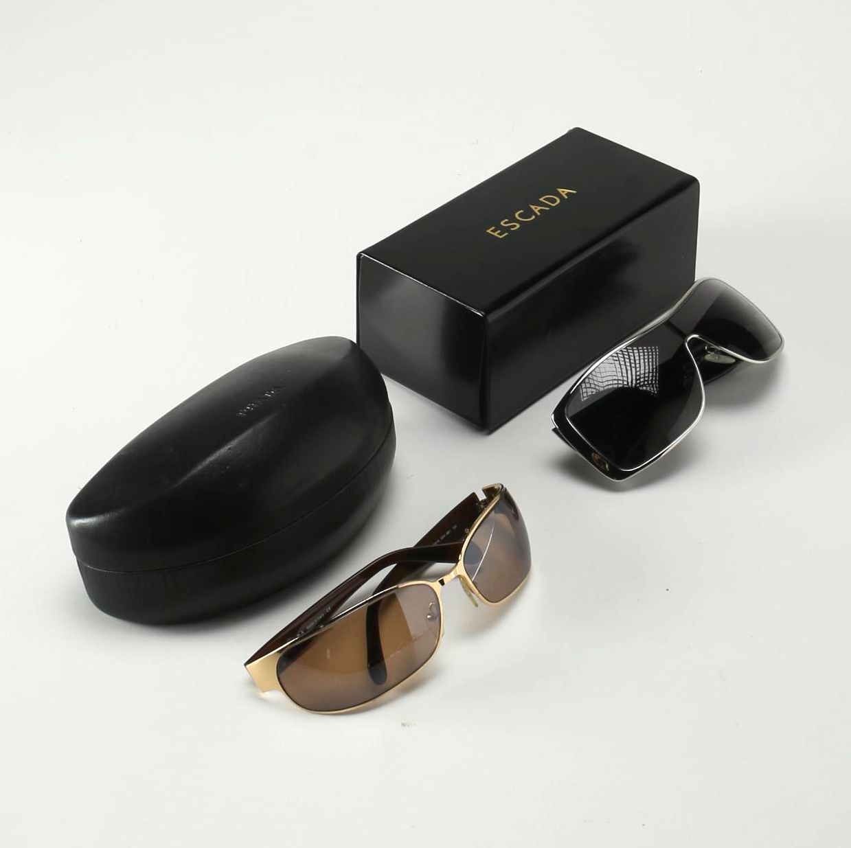 Sunglasses by Prada and Escada