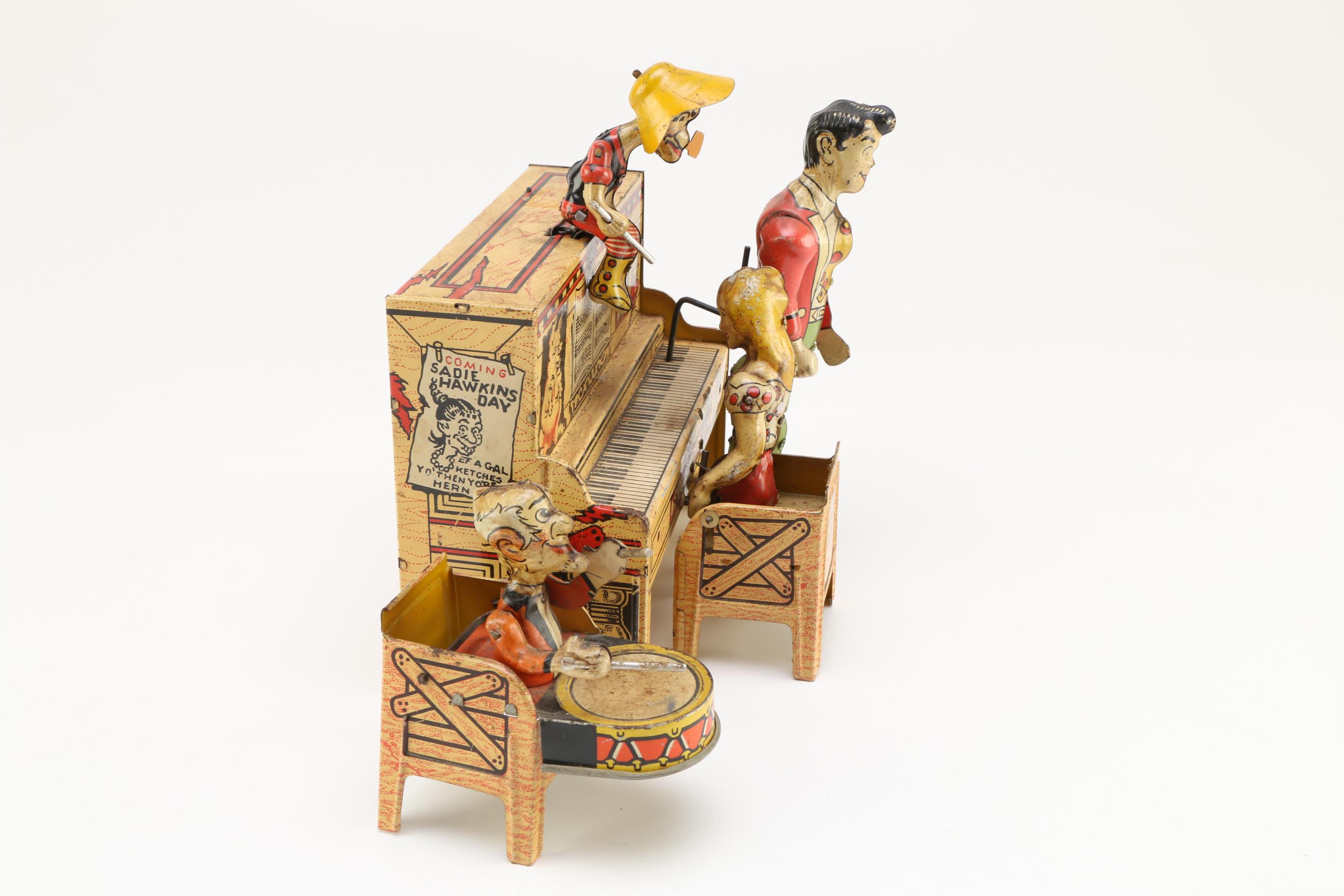 1945 Unique Art Mfg Co. "Lil' Abner Dogpatch Band" Tin Music Box