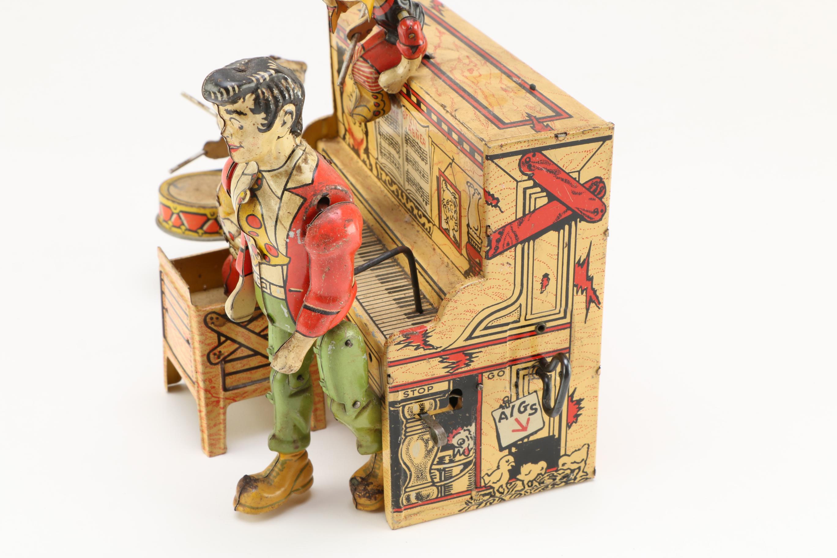 1945 Unique Art Mfg Co. "Lil' Abner Dogpatch Band" Tin Music Box