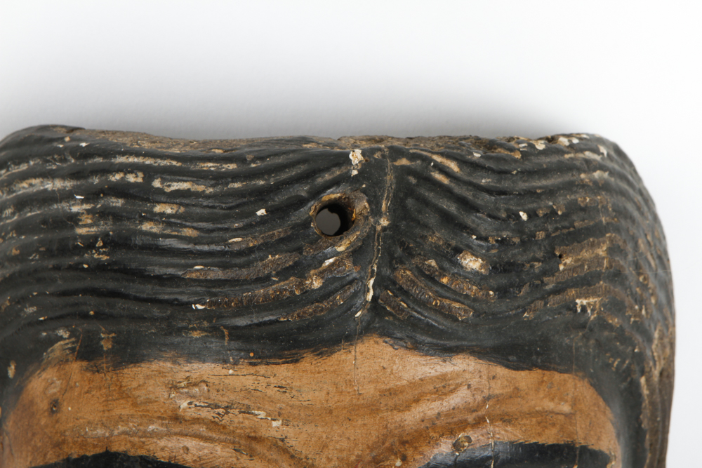 A Hand Painted Wooden Mask