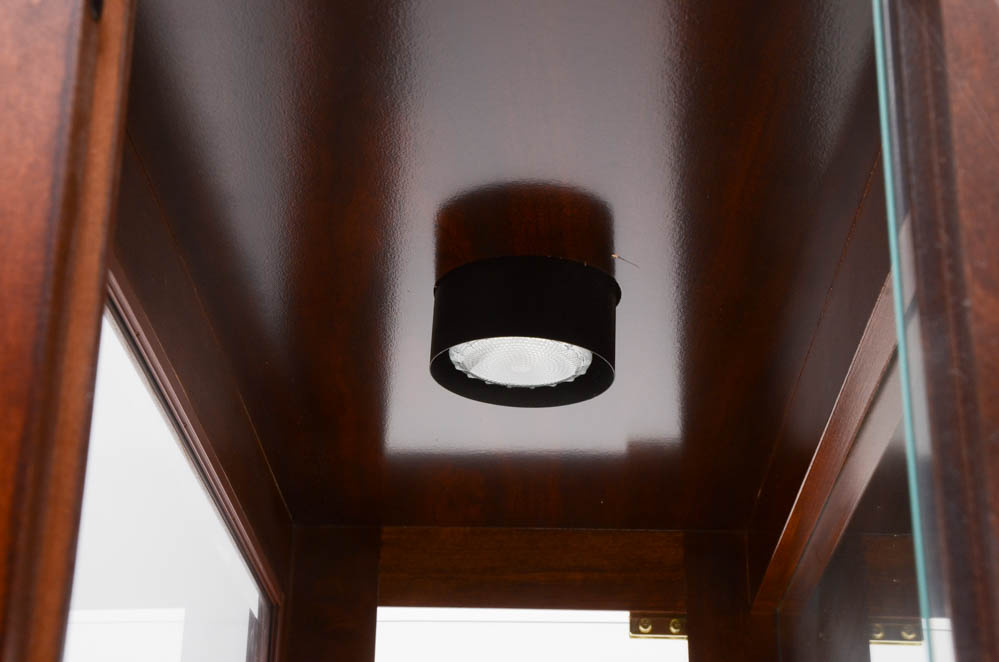 Howard Miller illuminated Cherry Curio Cabinet