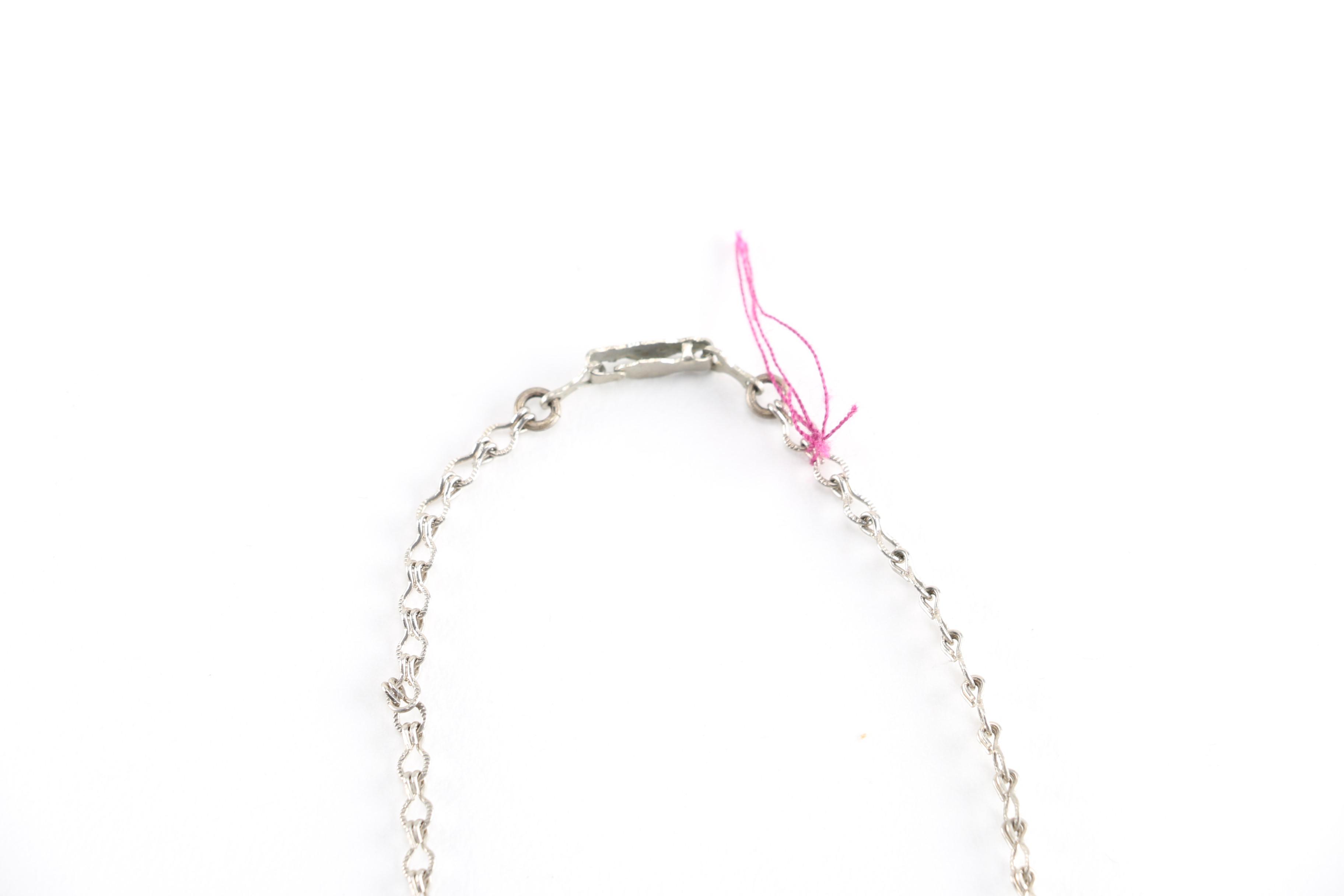 Assortment of Silver Tone Costume Jewelry Featuring Swarovski