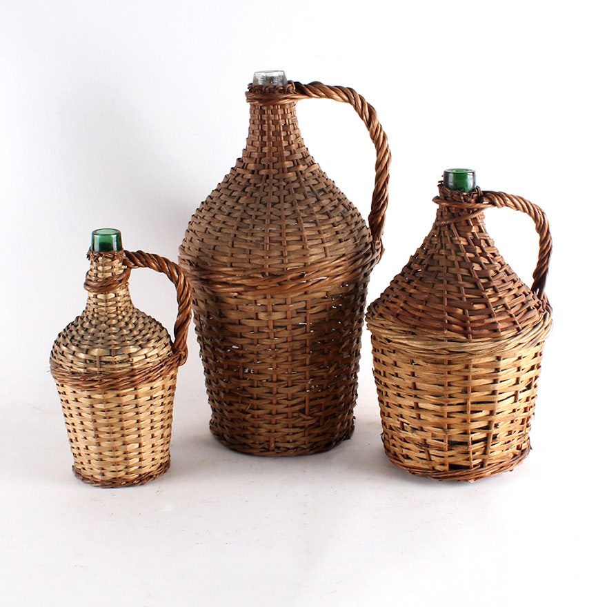 Vintage Three Green Glass Wine Jugs with Wicker Basket Covering