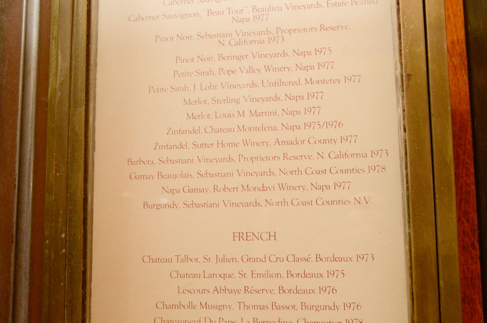 Glass and Brass Wine List Display Case