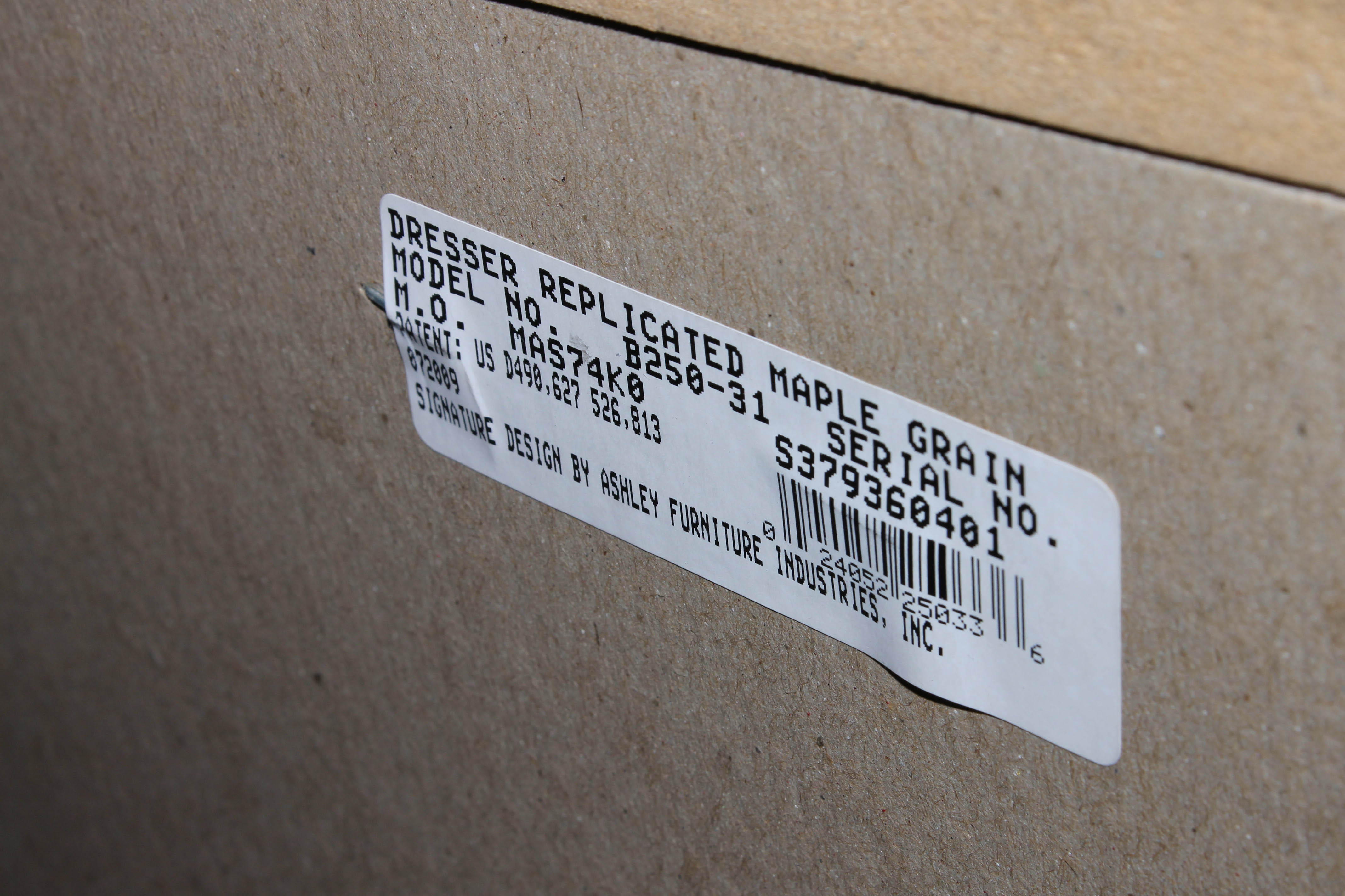 Contemporary Faux Maple Dresser by Ashley Furniture