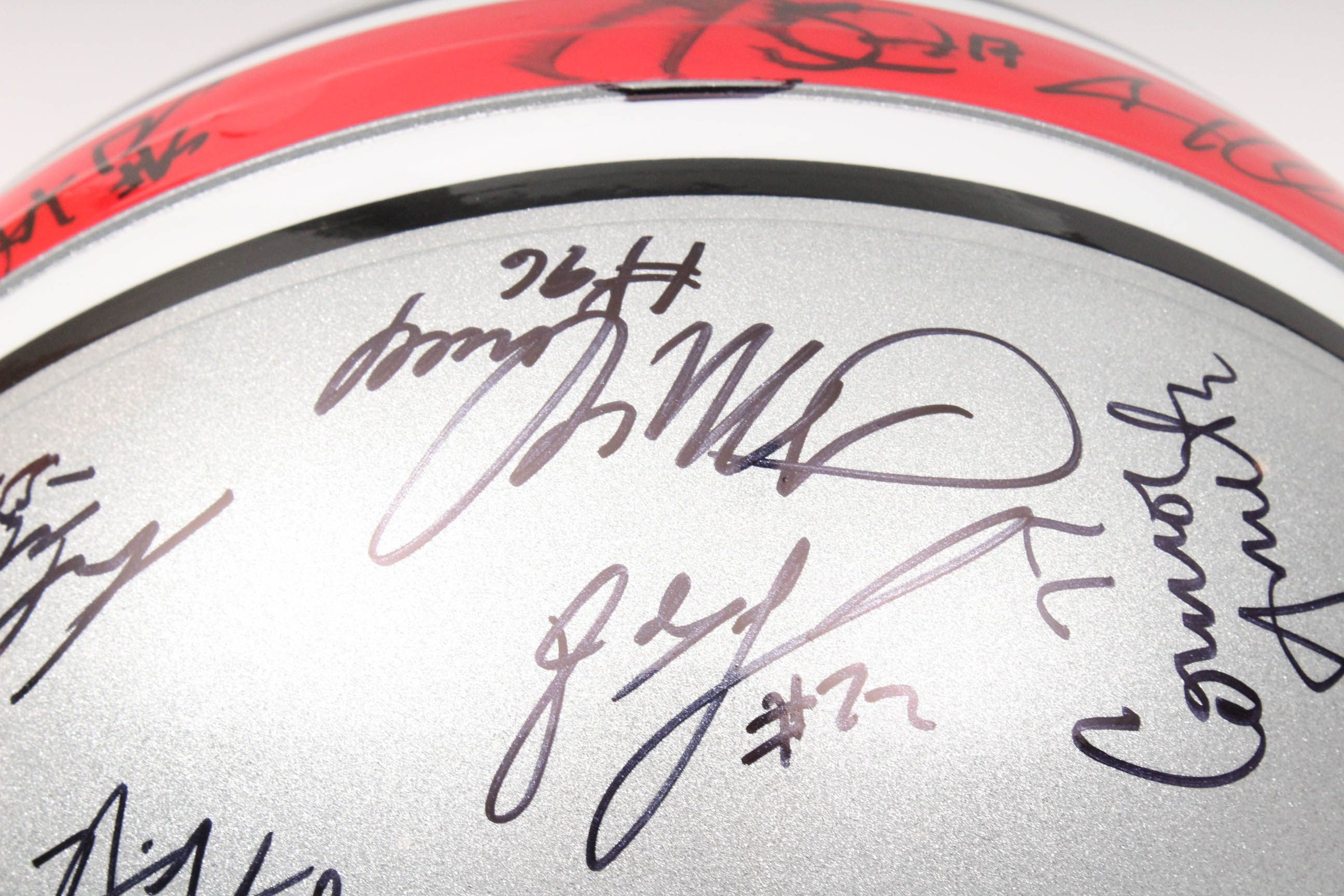 Jim Tressel and Players Autographed OSU Helmet