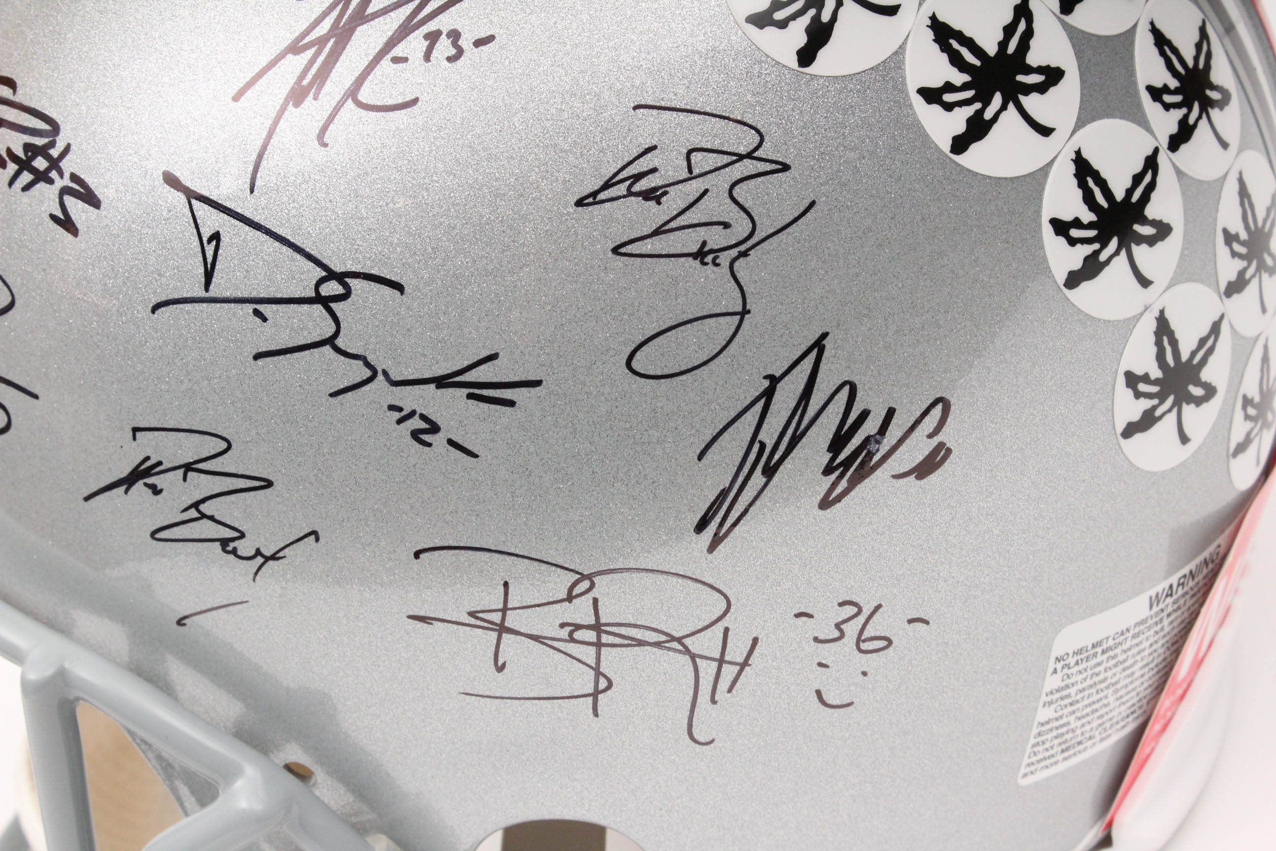 Jim Tressel and Players Autographed OSU Helmet