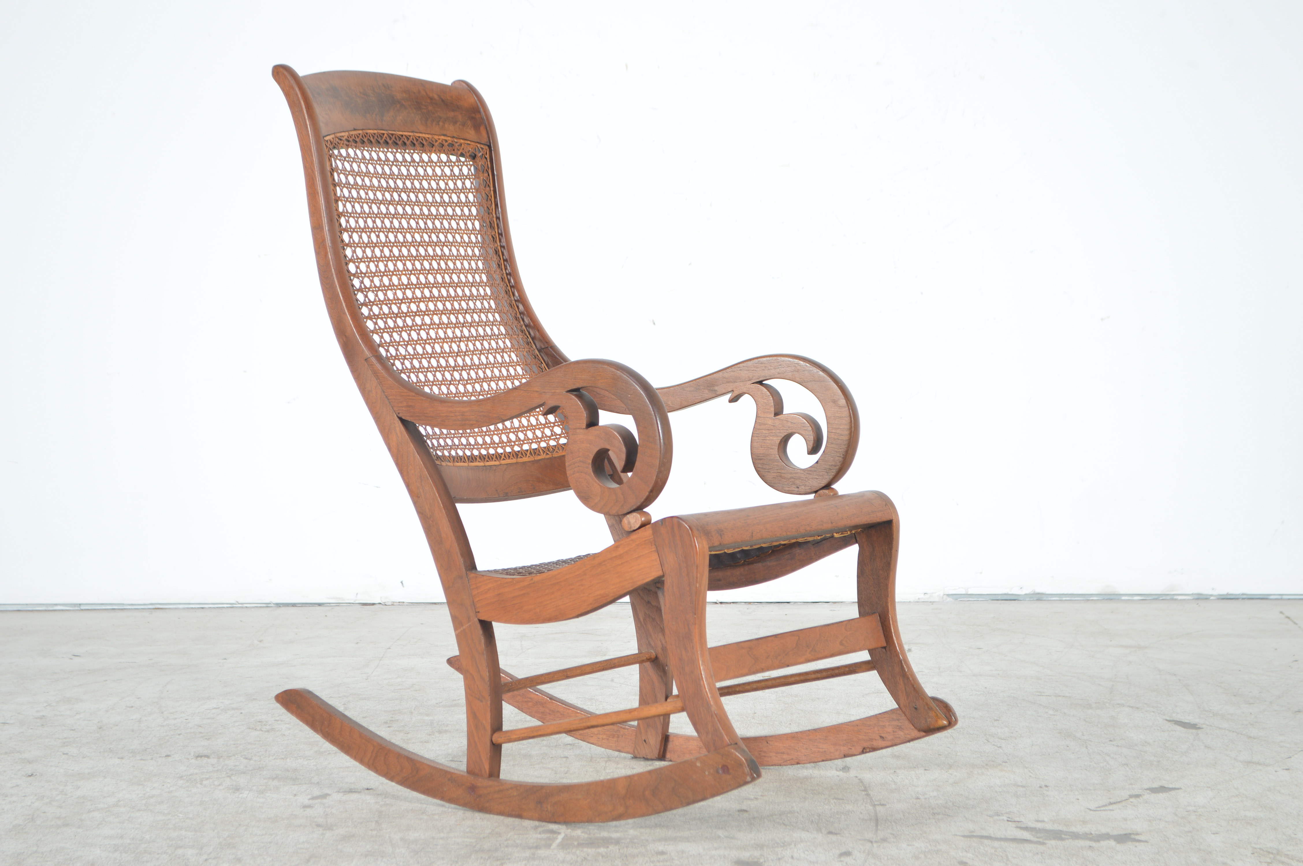 Antique Rocking Chair with Cane Seat and Back