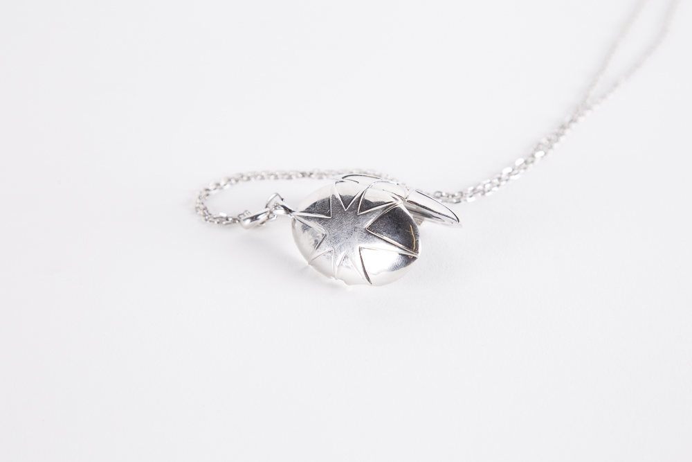 Sterling Silver And Cubic Zirconia Starburst Locket on a Sterling Chain