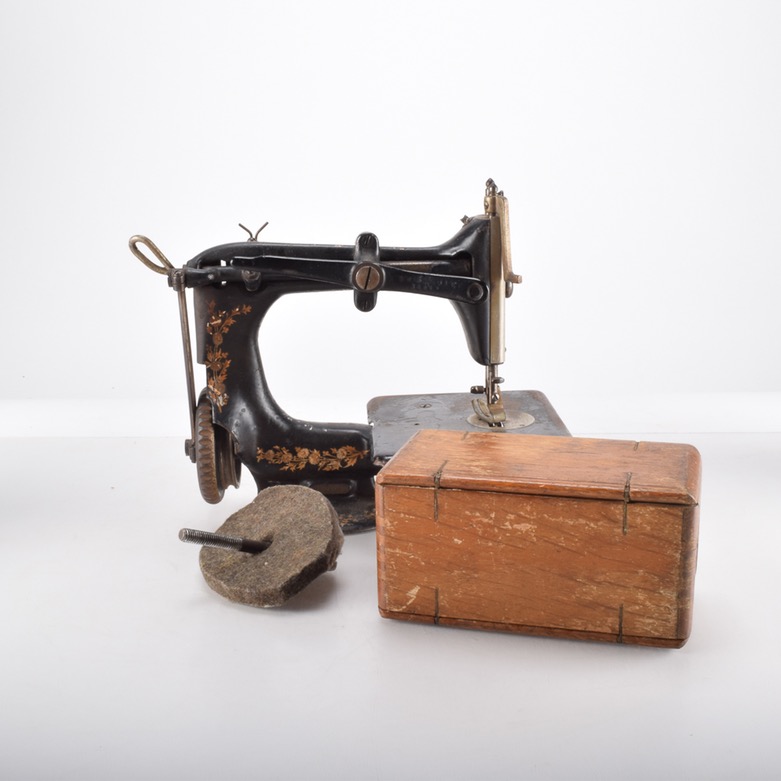 Antique Iron Mobile Singer Sewing Machine and Box of Attachments