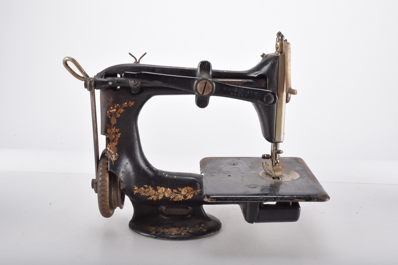 Antique Iron Mobile Singer Sewing Machine and Box of Attachments