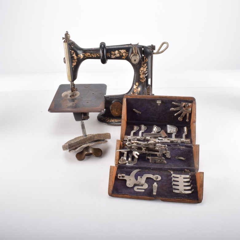 Antique Iron Mobile Singer Sewing Machine and Box of Attachments
