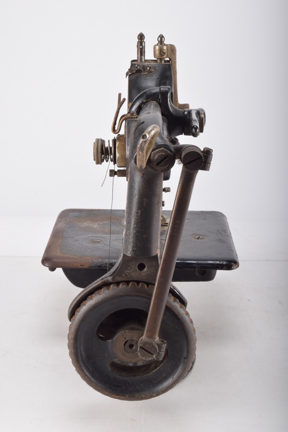 Antique Iron Mobile Singer Sewing Machine and Box of Attachments