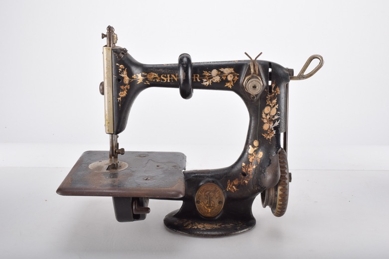 Antique Iron Mobile Singer Sewing Machine and Box of Attachments