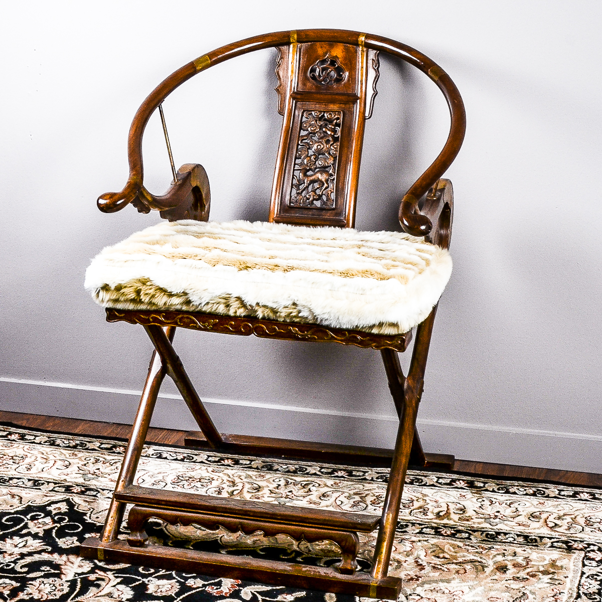 20th Century Chinese Carved Horseshoe-Back Folding Armchair