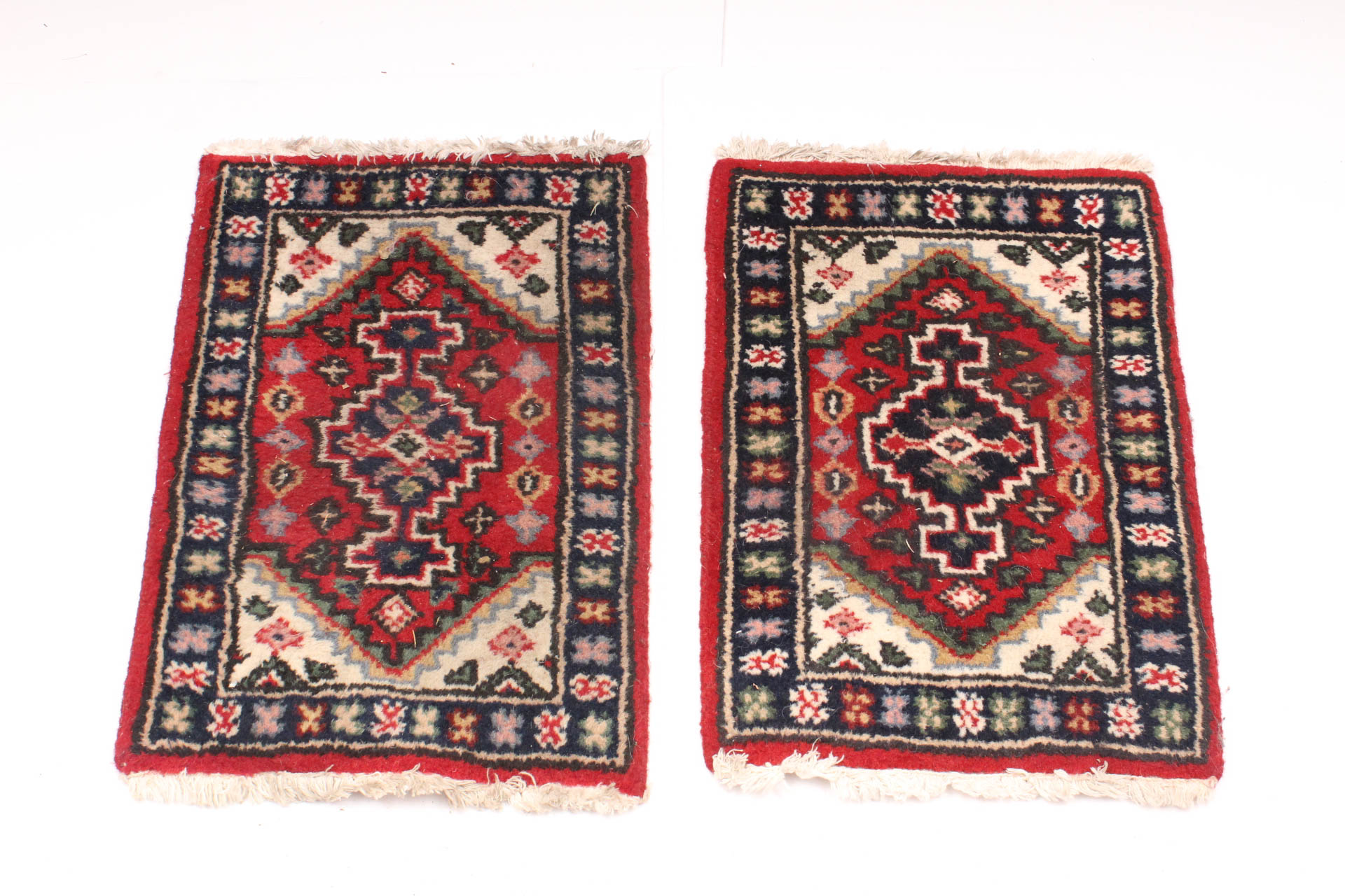 Matching Pair of Handwoven Persian Accent Rugs