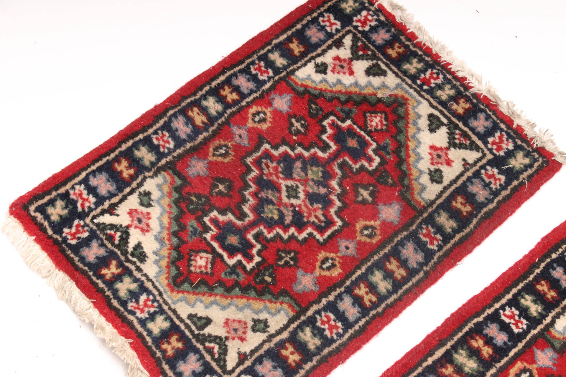 Matching Pair of Handwoven Persian Accent Rugs