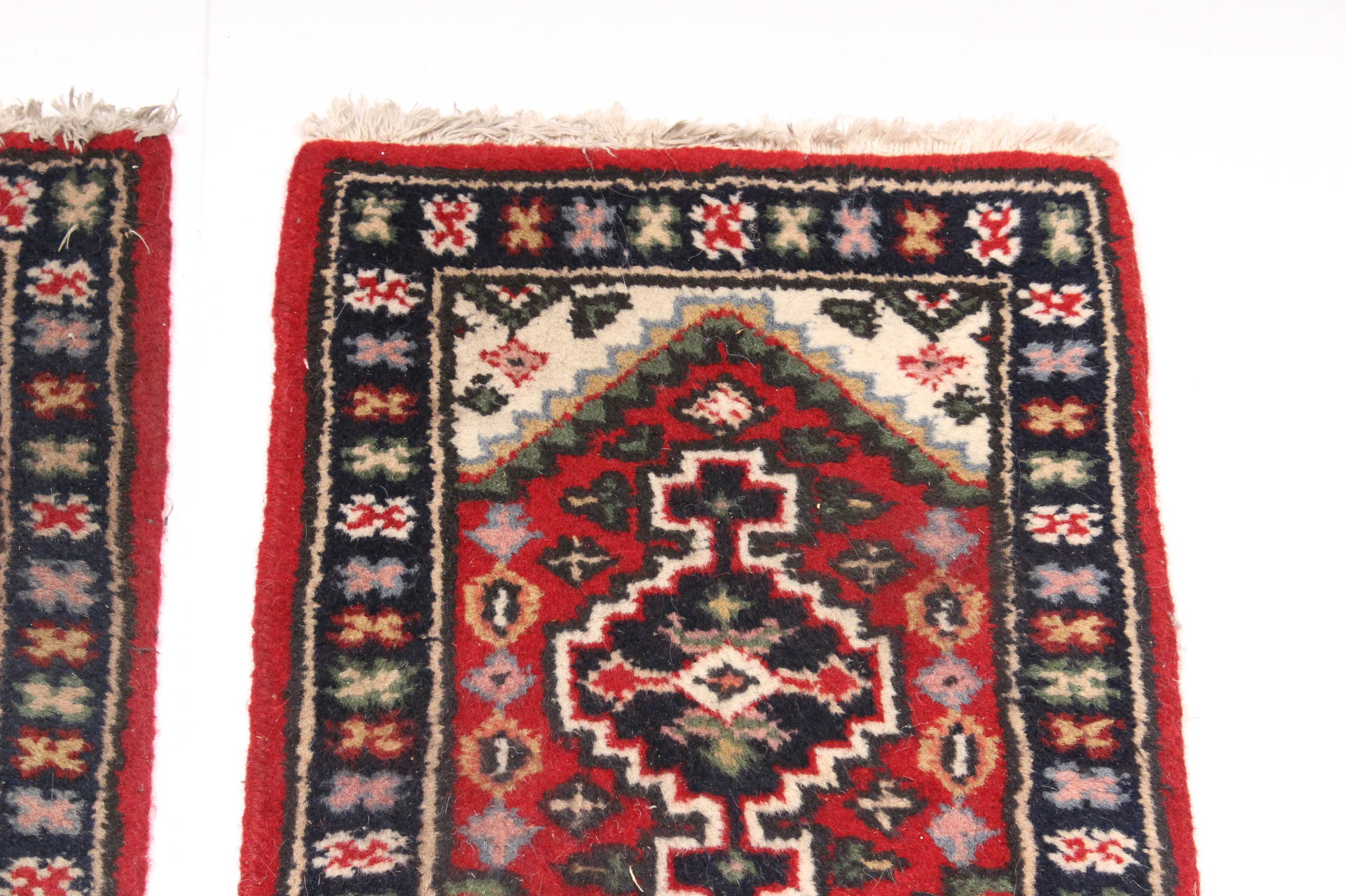 Matching Pair of Handwoven Persian Accent Rugs
