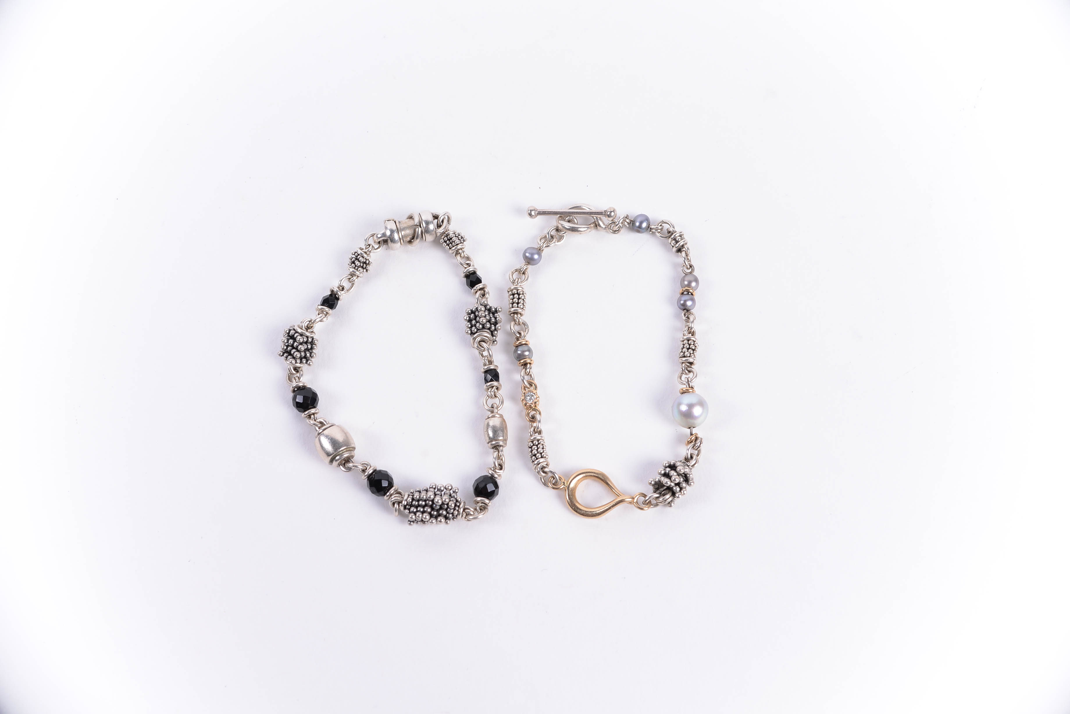 Pair of Sterling Silver Bracelets Including Michael Dawkins