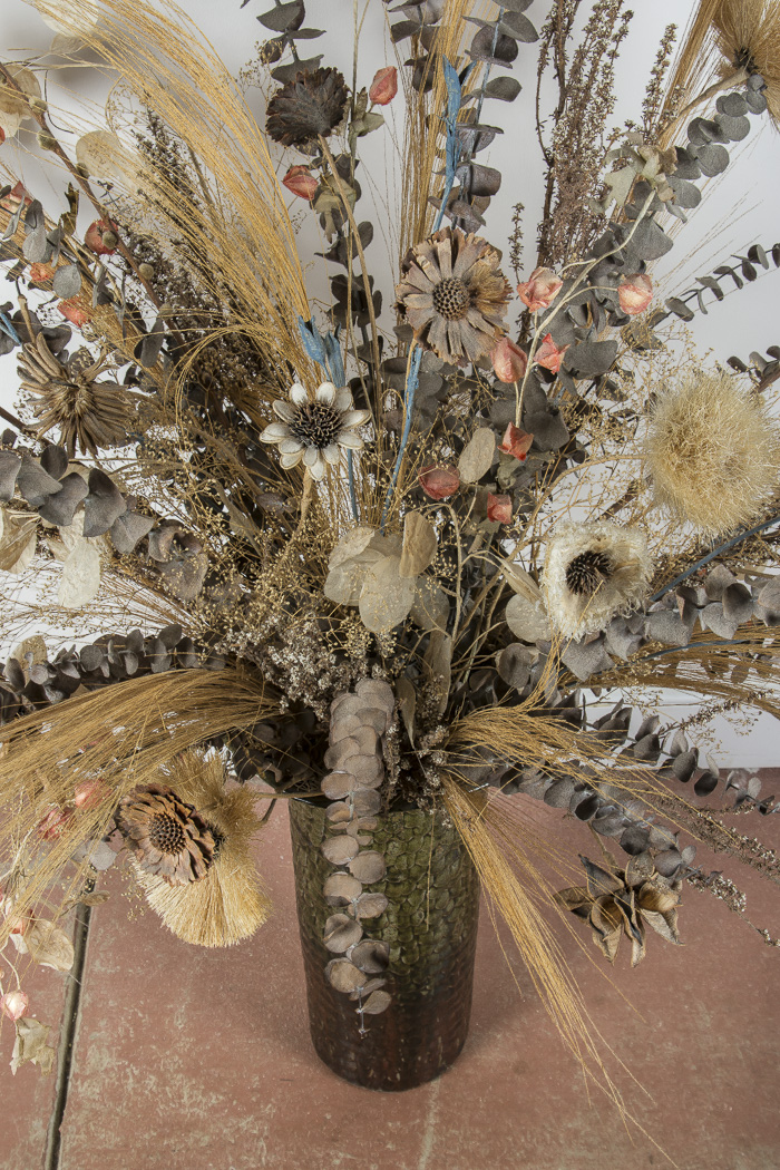 Pottery Vase and Decorative Floral Arrangement