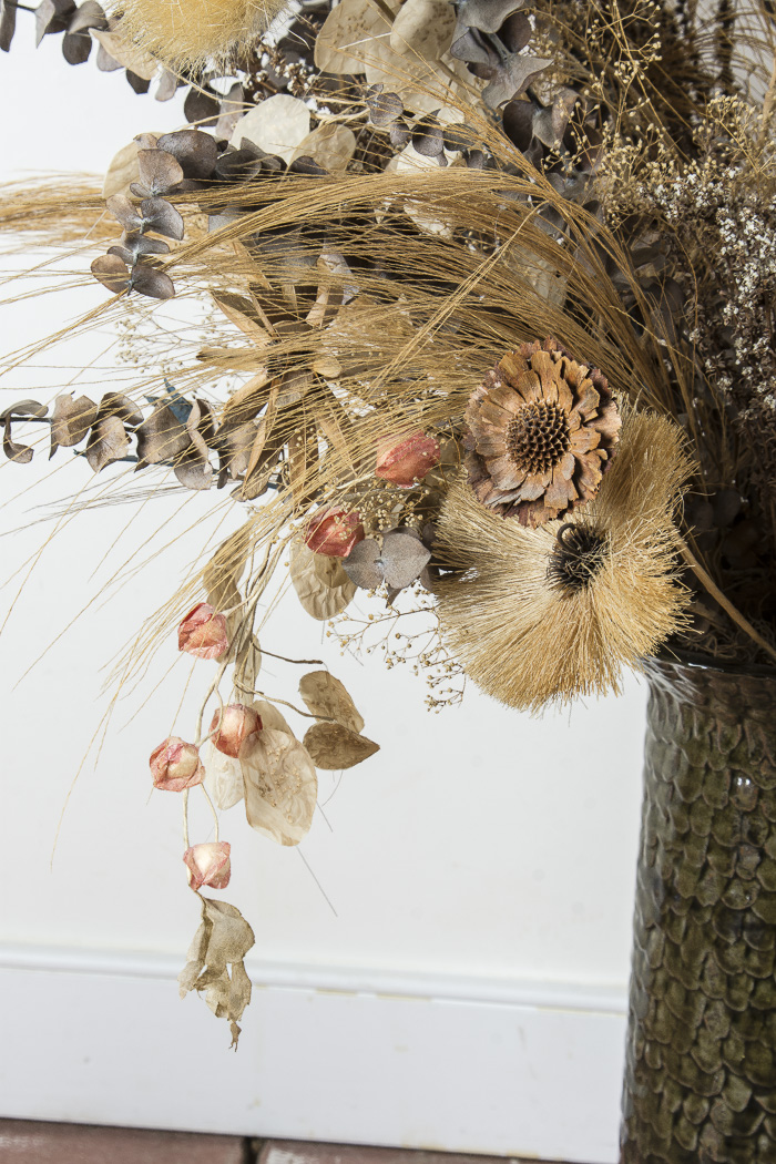 Pottery Vase and Decorative Floral Arrangement