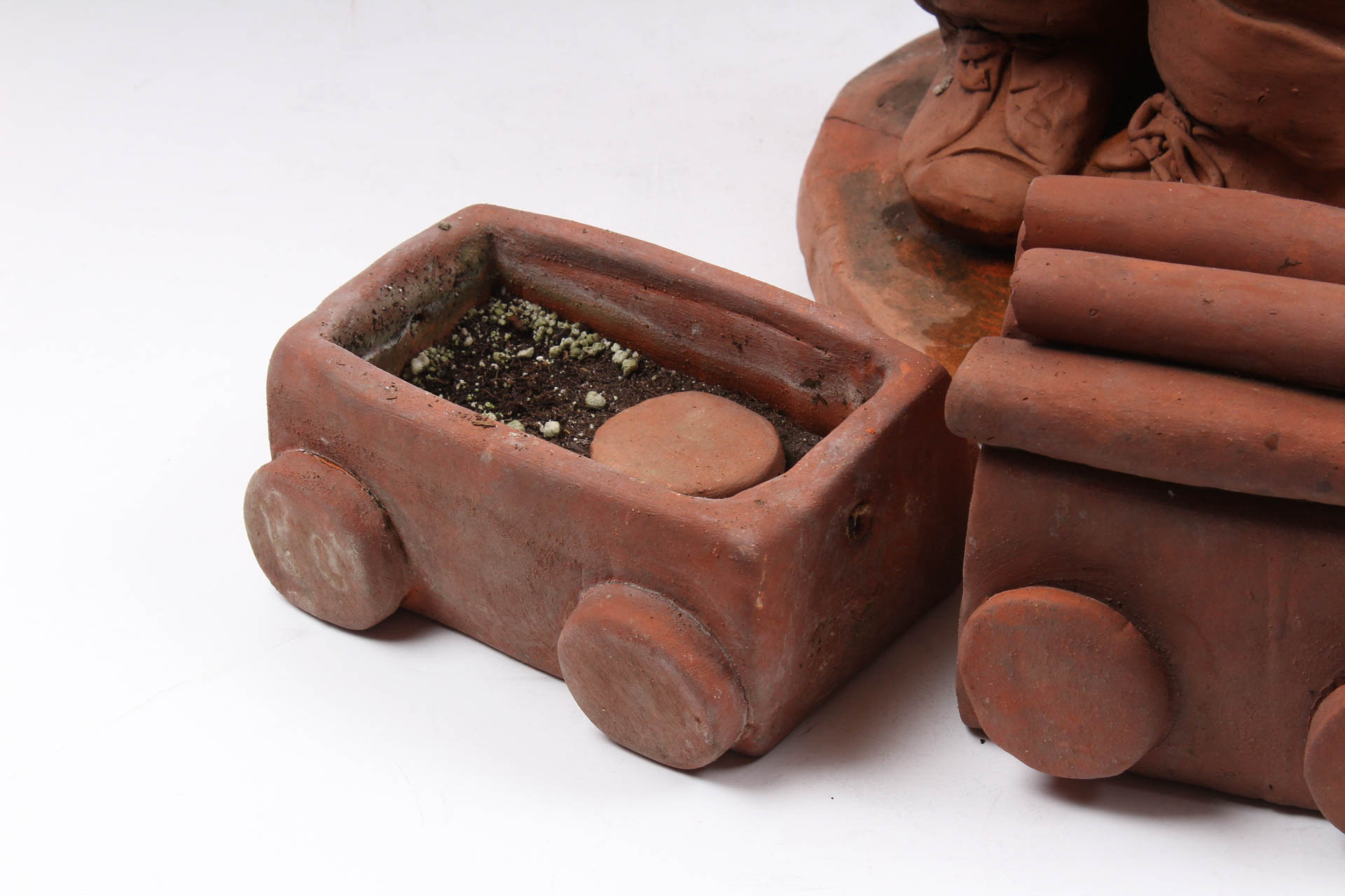 Ann Entis Boy and Train Terracotta Sculptures