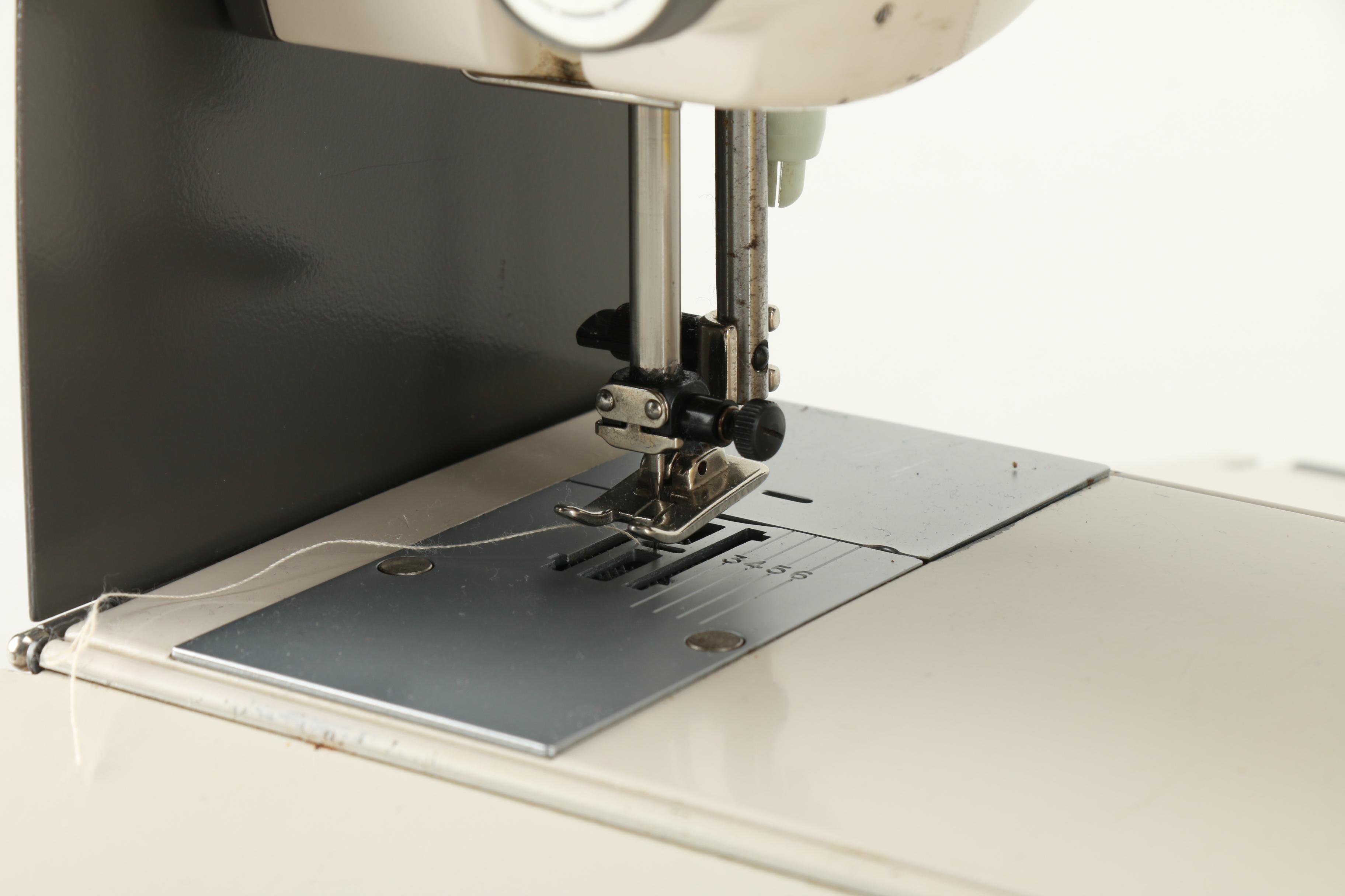 Elna "Lotus SP' Sewing Machine and Accordion Case Filled with Sewing Supplies