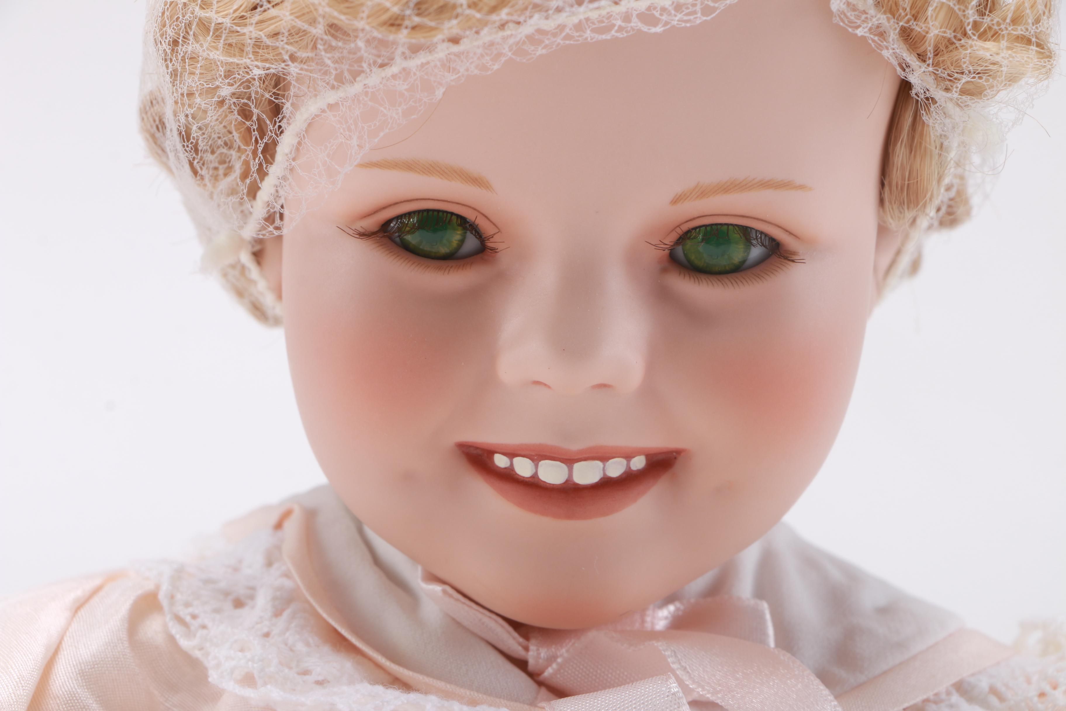 Four Danbury Mint Shirley Temple Dolls