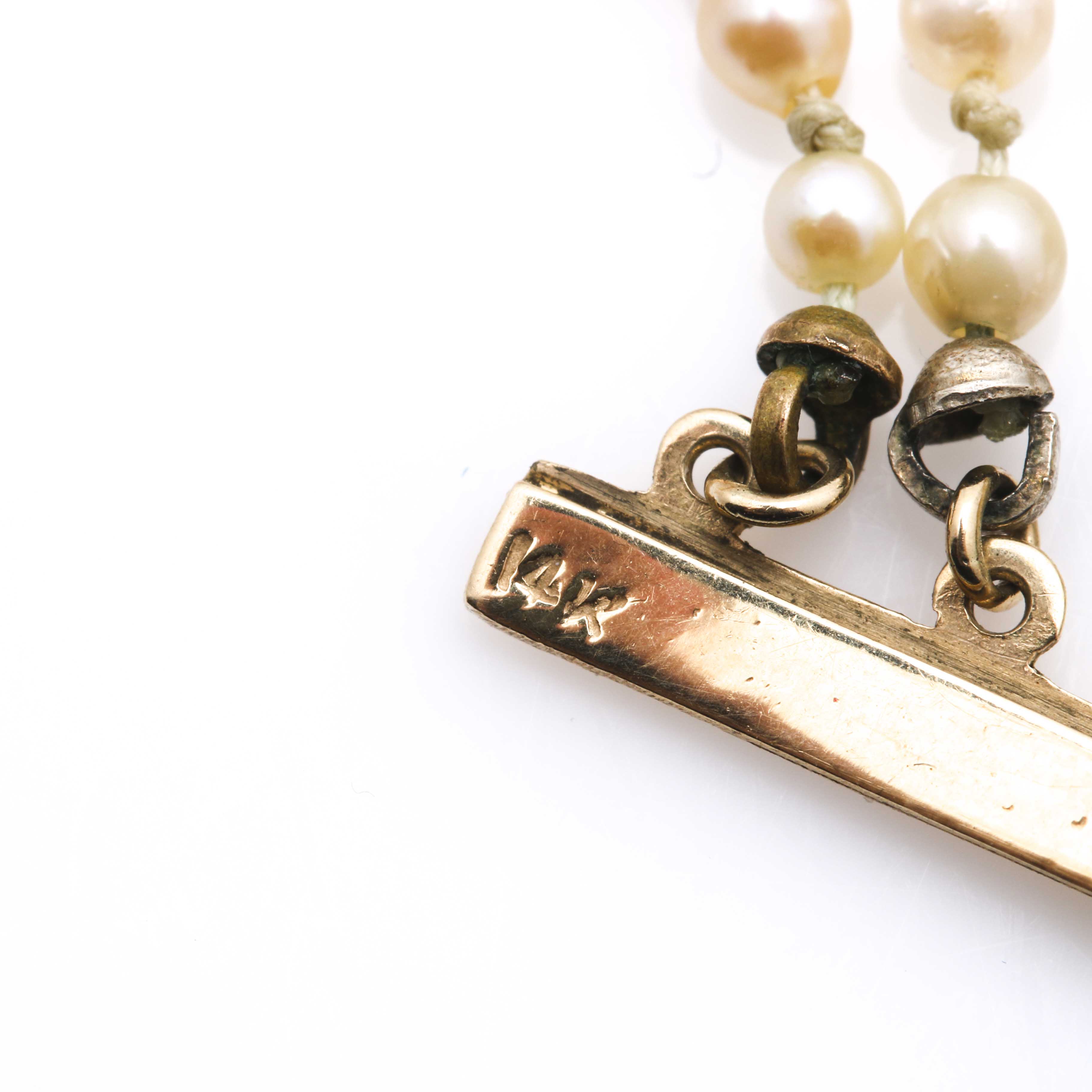 Multi Strand Pearl Bracelet With 14K Yellow Gold Findings and Emeralds