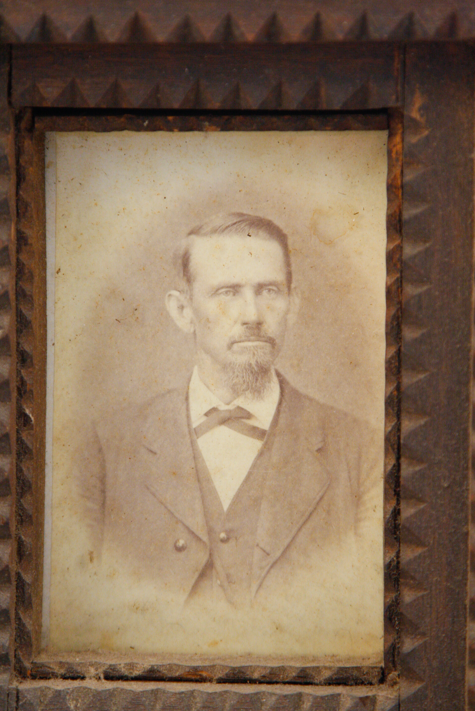 Carved Tramp Art Frame with Pair of Antique Portraits