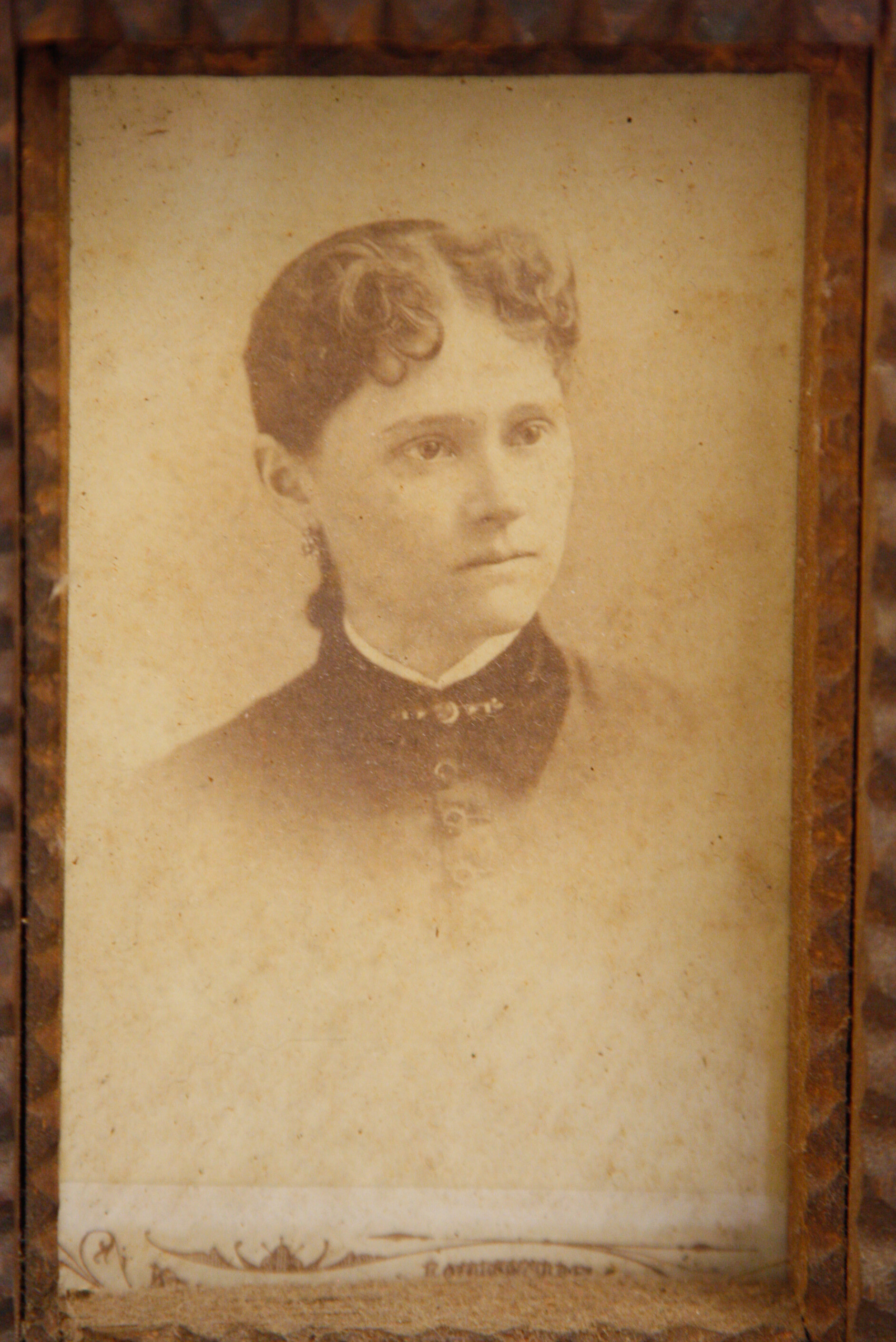 Carved Tramp Art Frame with Pair of Antique Portraits