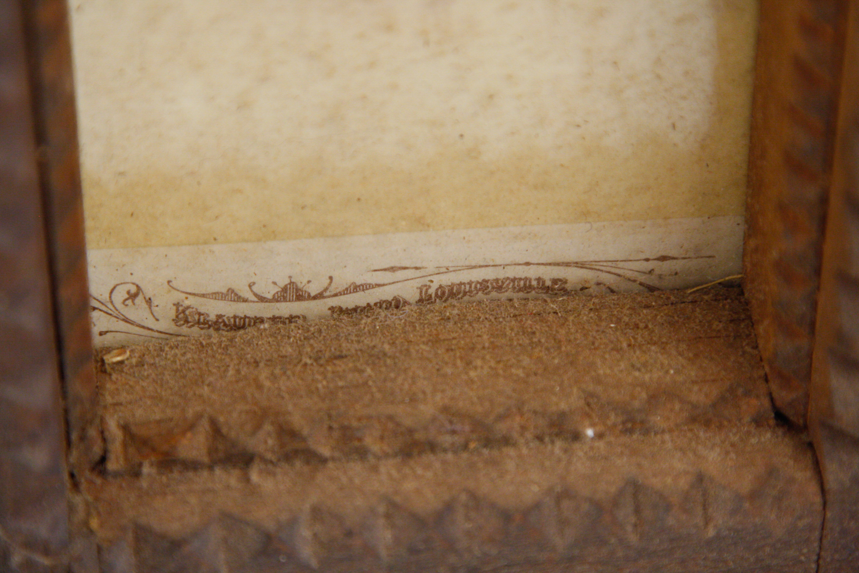 Carved Tramp Art Frame with Pair of Antique Portraits