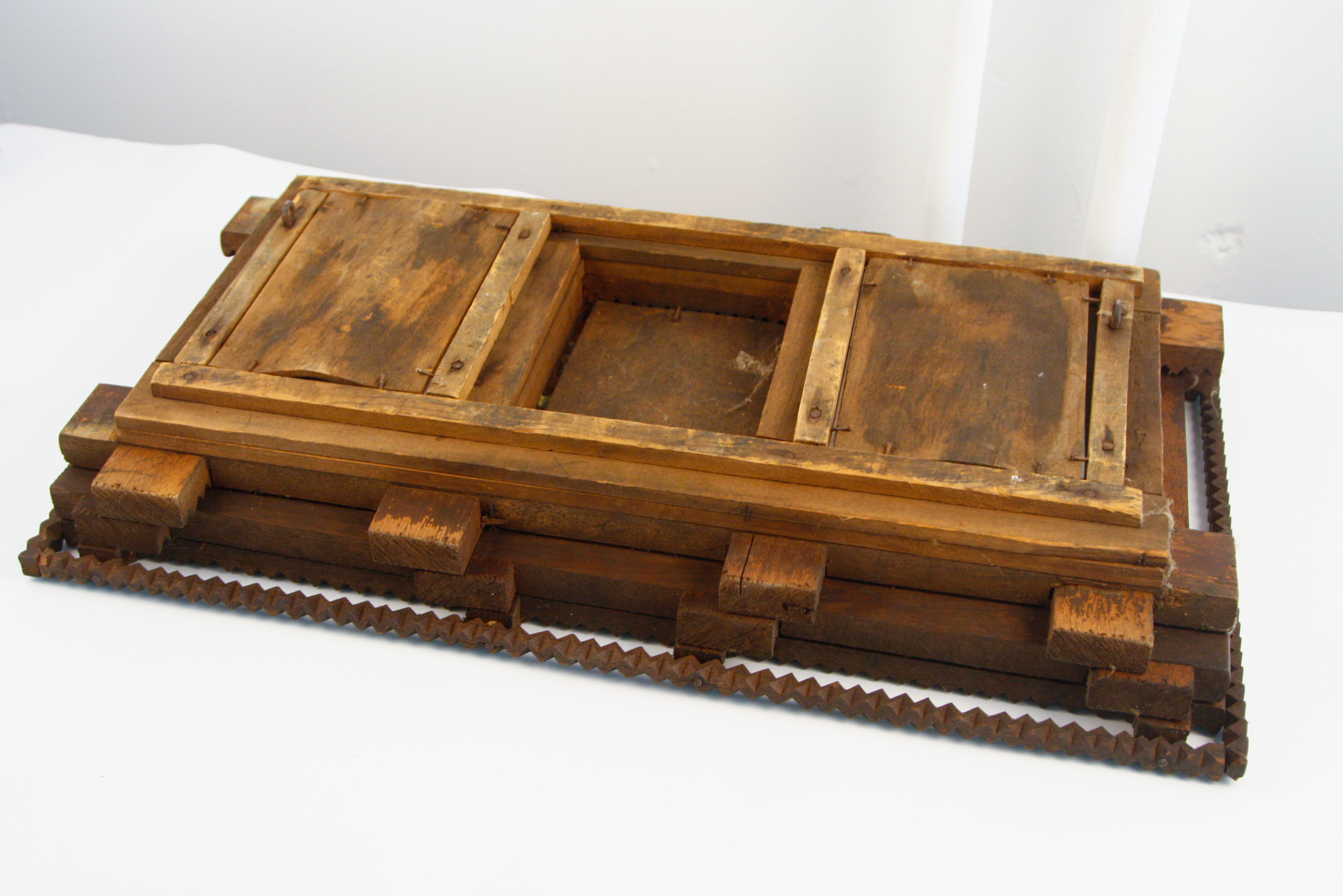 Carved Tramp Art Frame with Pair of Antique Portraits