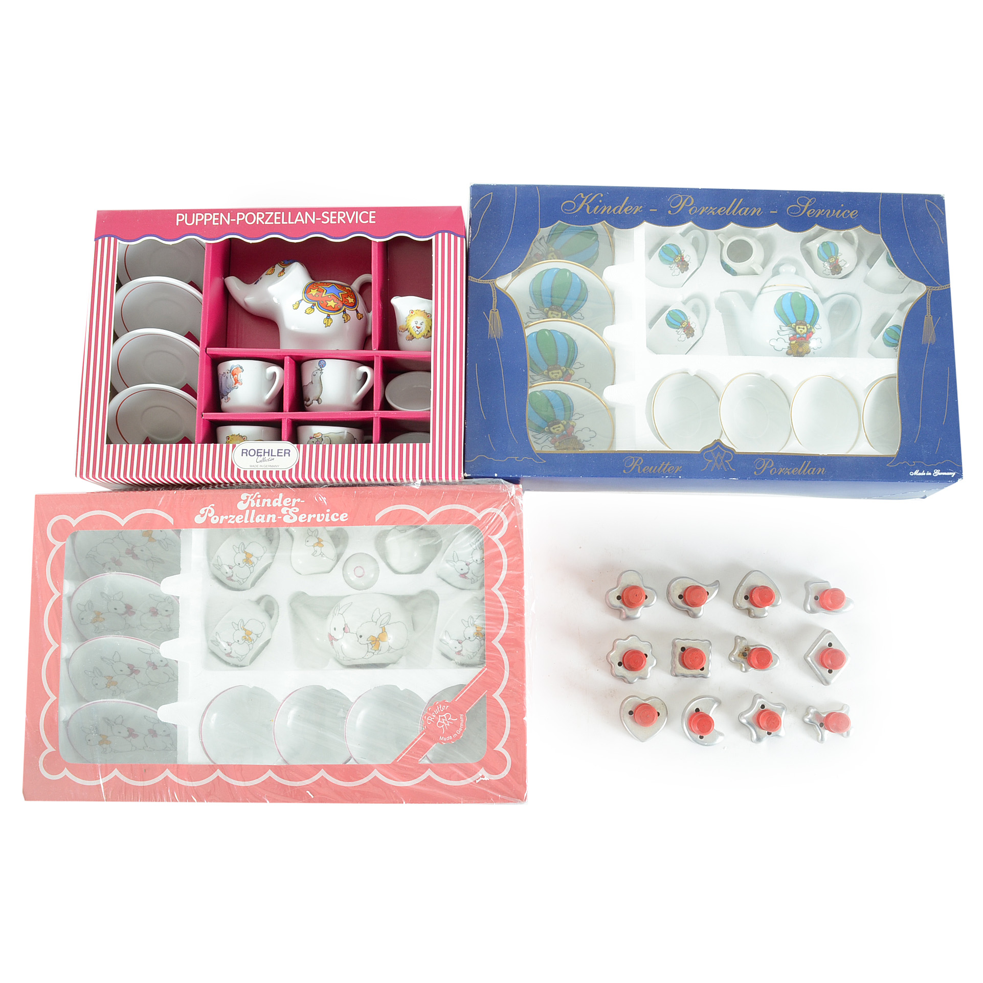 Three Children's Kinder-Porzellan Tea Sets with Cookie Cutters
