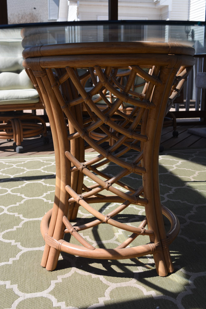 Glass-Top Pedestal Table with Rattan Chairs