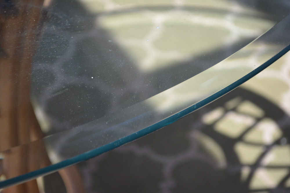 Glass-Top Pedestal Table with Rattan Chairs