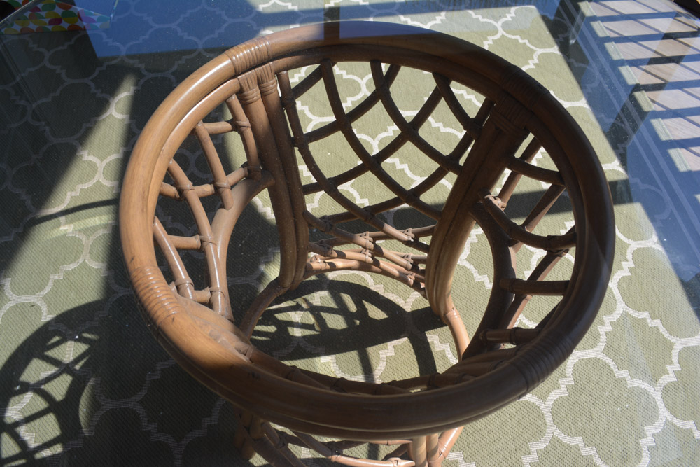 Glass-Top Pedestal Table with Rattan Chairs