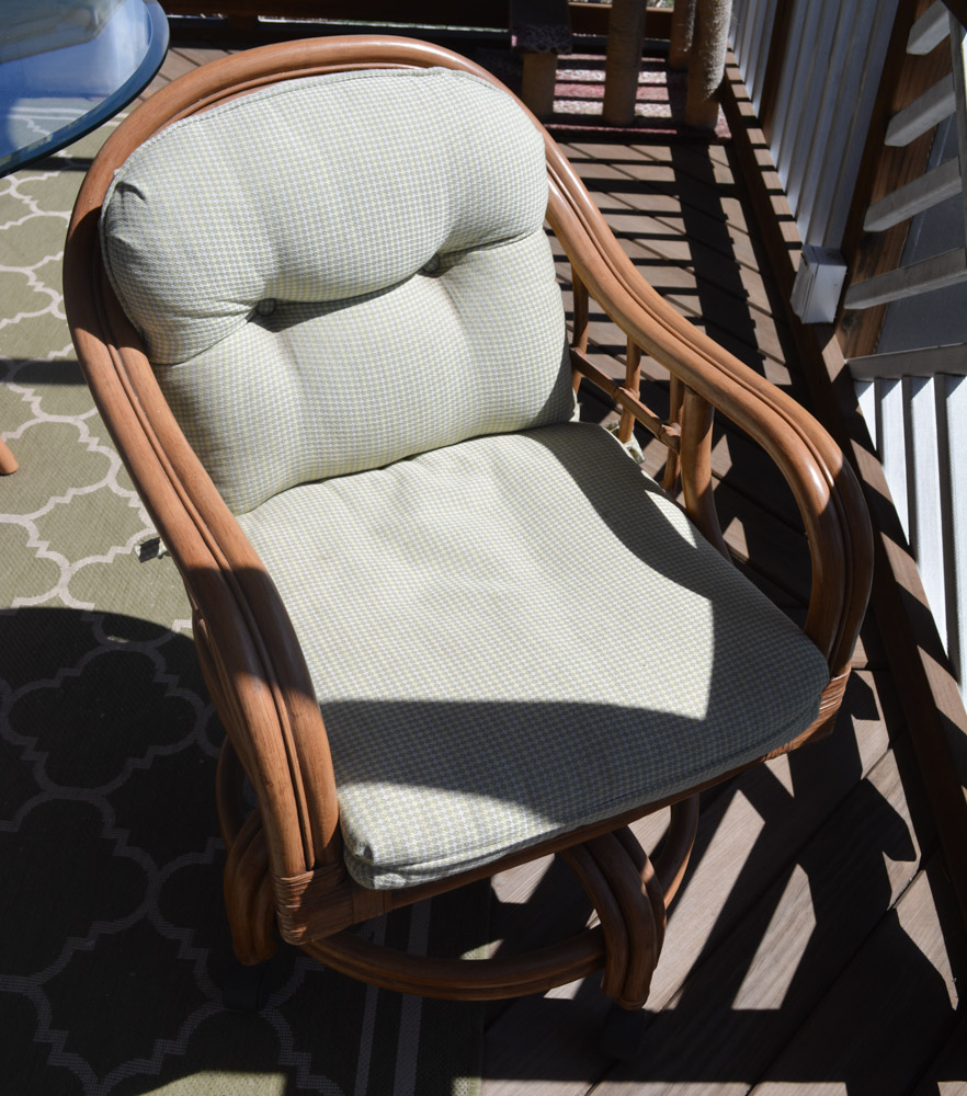 Glass-Top Pedestal Table with Rattan Chairs