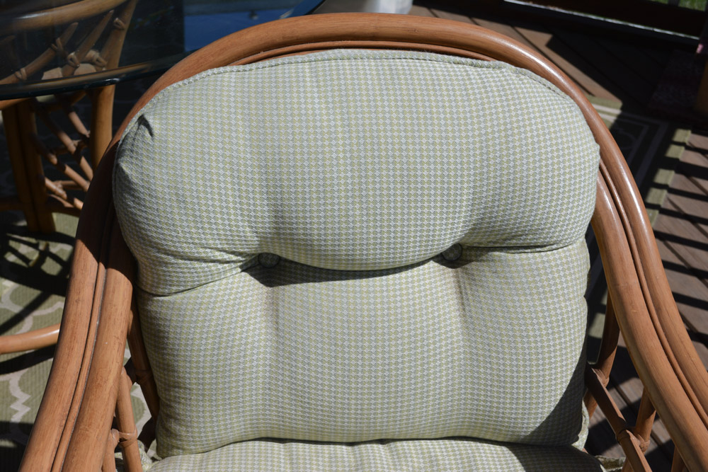 Glass-Top Pedestal Table with Rattan Chairs