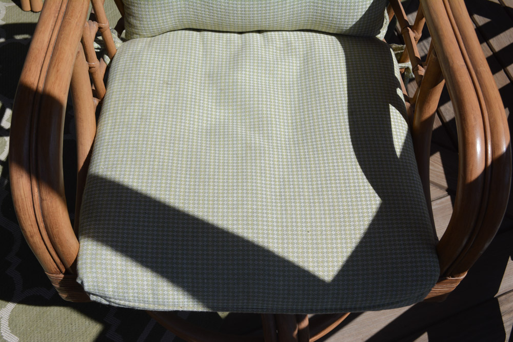 Glass-Top Pedestal Table with Rattan Chairs