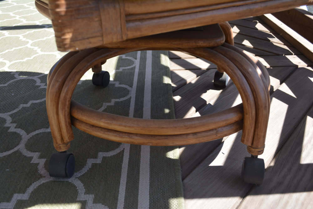 Glass-Top Pedestal Table with Rattan Chairs